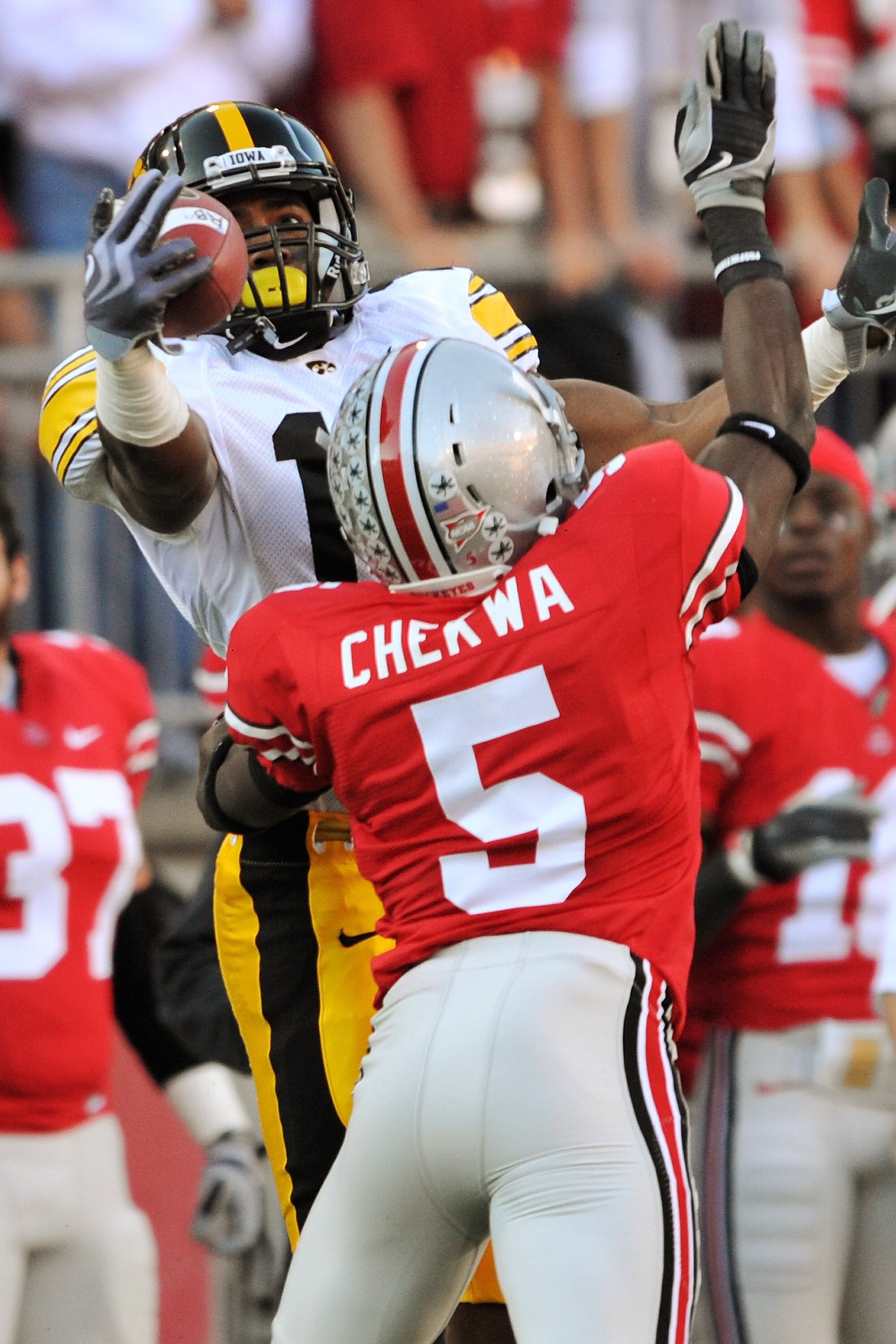 COLUMBUS, OH - NOVEMBER 14:  Wide receiver Derrell Johnson-Koulianos #15 of the Iowa Hawkeyes tries to haul in a pass as he is defended by Chimdi Chekwa #5 of the Ohio State Buckeyes at Ohio Stadium on November 14, 2009 in Columbus, Ohio. Chekwa was calle