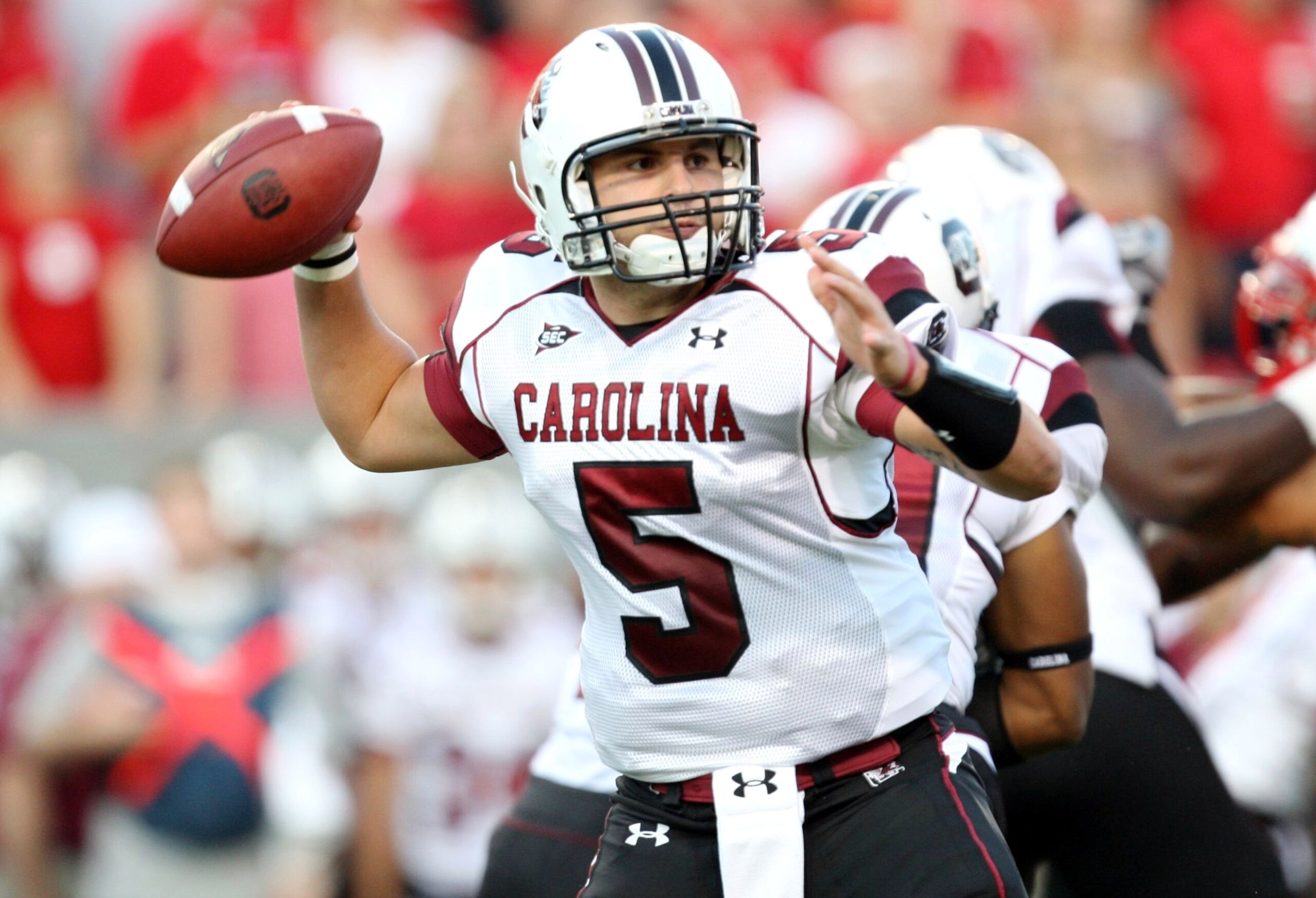 RALEIGH, NC - SEPTEMBER 3:  Quarterback Stephen Garcia #5 of the South Carolina Gamecocks drops back to pass against the North Carolina State Wolfpack during the game at Carter-Finley Stadium on September 3, 2009 in Raleigh, North Carolina. (Photo by Stre