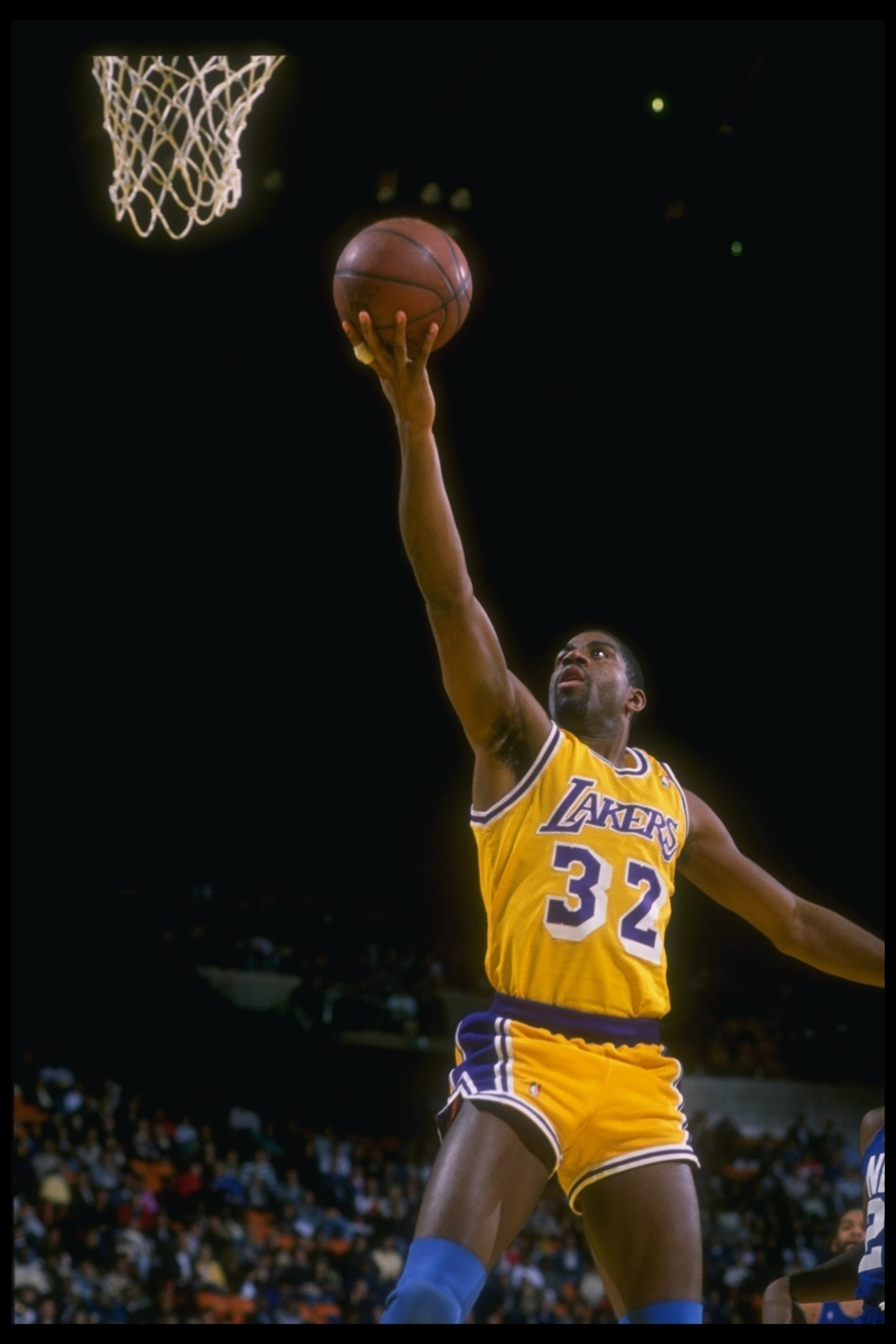 1988-1989:  Guard Earvin (Magic) Johnson of the Los Angeles Lakers goes up for two during a game. Mandatory Credit: Stephen Dunn  /Allsport Mandatory Credit: Stephen Dunn  /Allsport