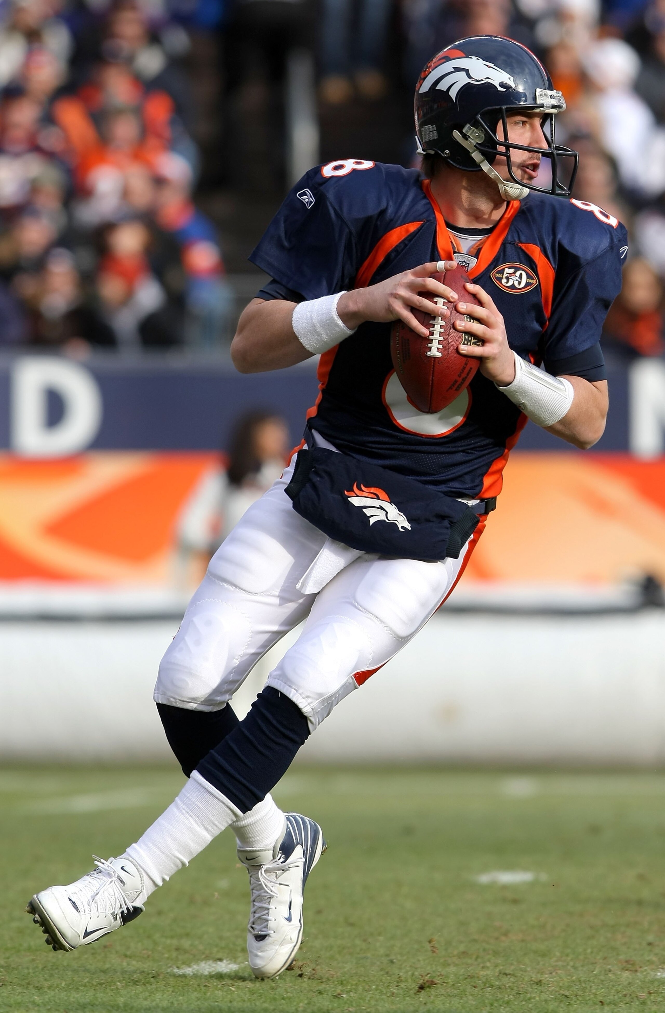 DENVER - JANUARY 03:  Quarterback Kyle Orton #8 of the Denver Broncos drops back to pass against the Kansas City Chiefs during NFL action at Invesco Field at Mile High on January 3, 2010 in Denver, Colorado. The Chiefs defeated the Broncos 44-24.  (Photo