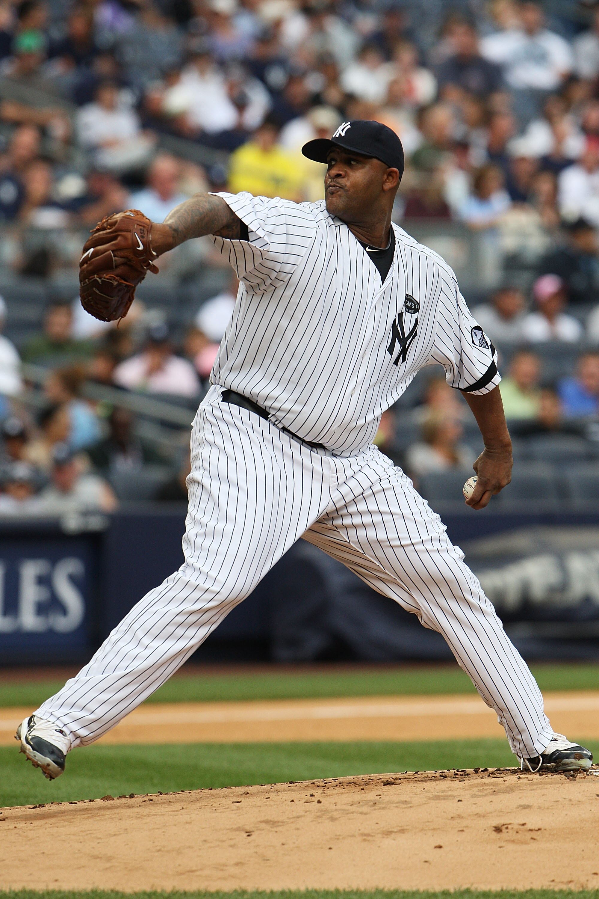 NEW YORK - AUGUST 22:  CC Sabathia #52 of the New York Yankees pitches against the Seattle Mariners on August 22, 2010 at Yankee Stadium in the Bronx borough of New York City.  (Photo by Andrew Burton/Getty Images)