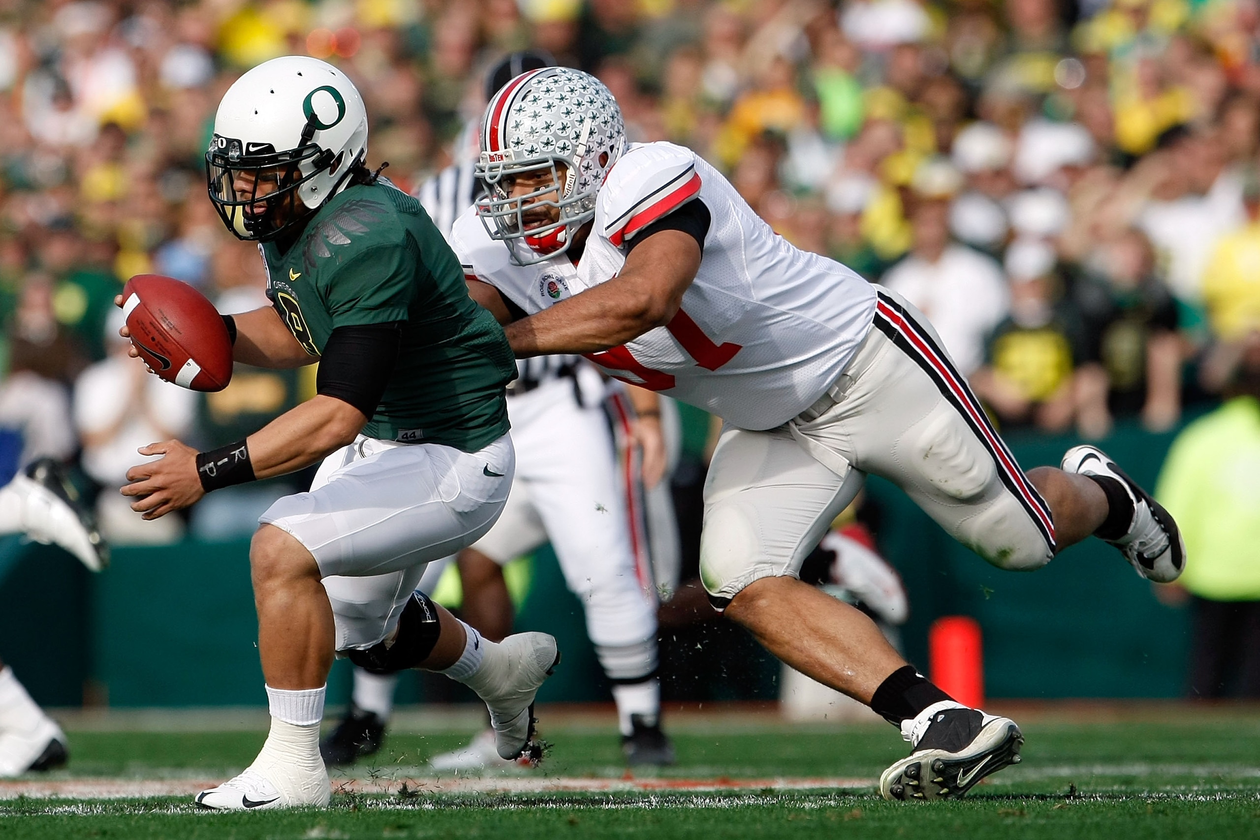 PASADENA, CA - JANUARY 01:  Defensive lineman Cameron Heyward #97 of the Ohio State Buckeyes sacks quarterback Jeremiah Masoli #8 of the Oregon Ducks during the 96th Rose Bowl game on January 1, 2010 in Pasadena, California.  (Photo by Jeff Gross/Getty Im