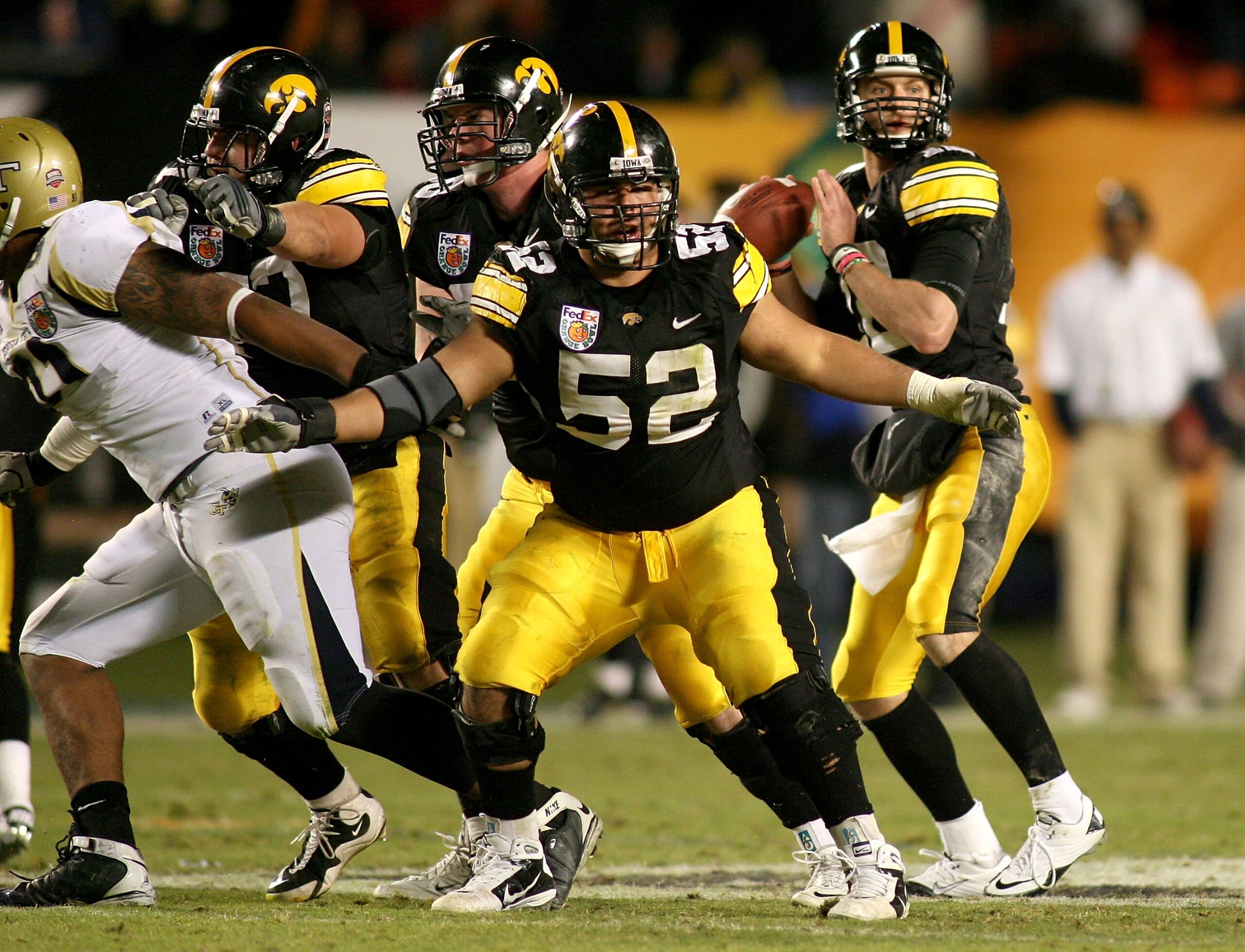 MIAMI GARDENS, FL - JANUARY 05:  Center Rafael Eubanks #52 of the Iowa Hawkeyes pass protects for quarteback Ricky Stanzi against the Georgia Tech Yellow Jackets during the FedEx Orange Bowl at Land Shark Stadium on January 5, 2010 in Miami Gardens, Flori