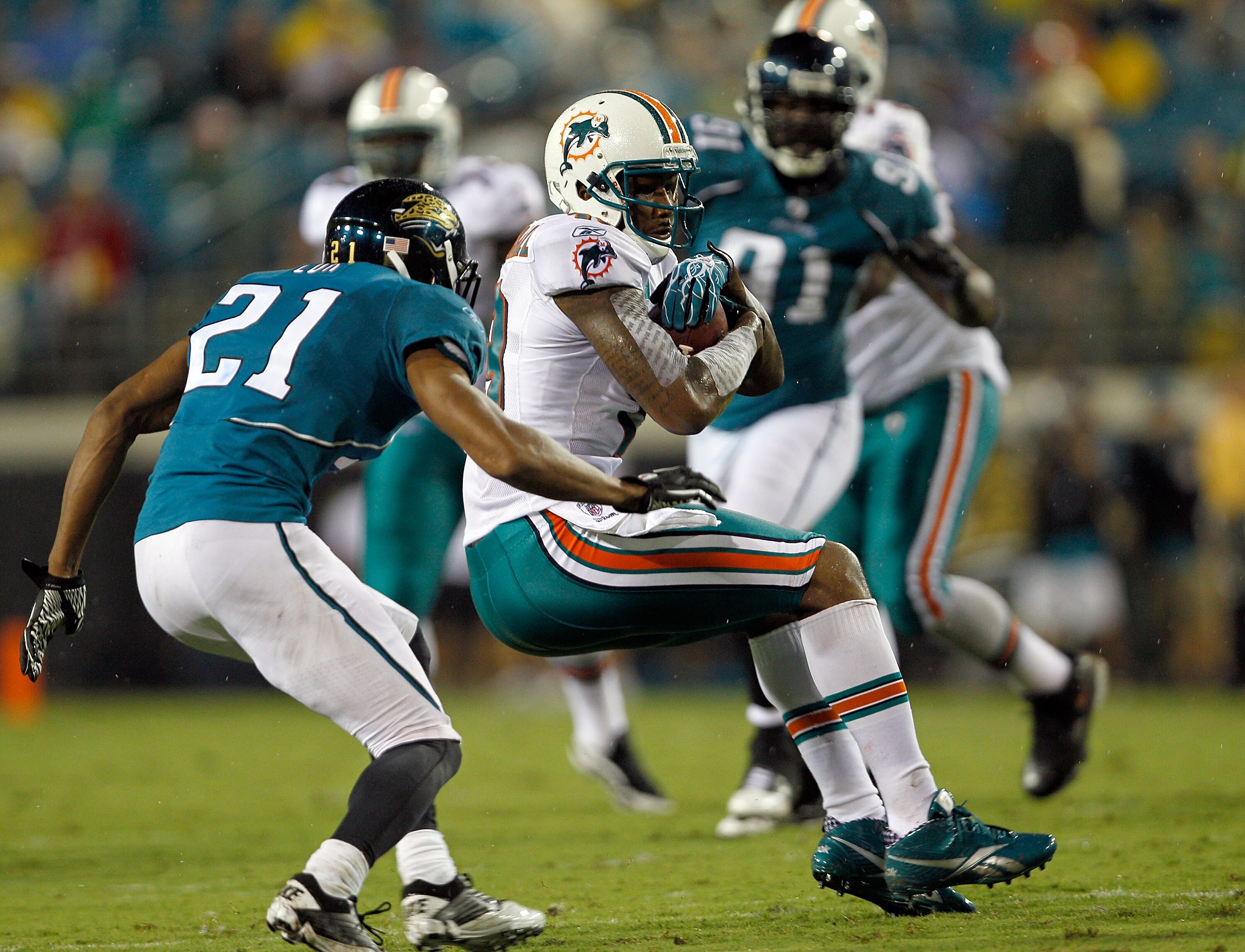 JACKSONVILLE, FL - AUGUST 21:  Brandon Marshall #19 of the Miami Dolphins catches a pass against Derek Cox #19 of the Jacksonville Jaguars during the preseason game at EverBank Field on August 21, 2010 in Jacksonville, Florida.  (Photo by Sam Greenwood/Ge