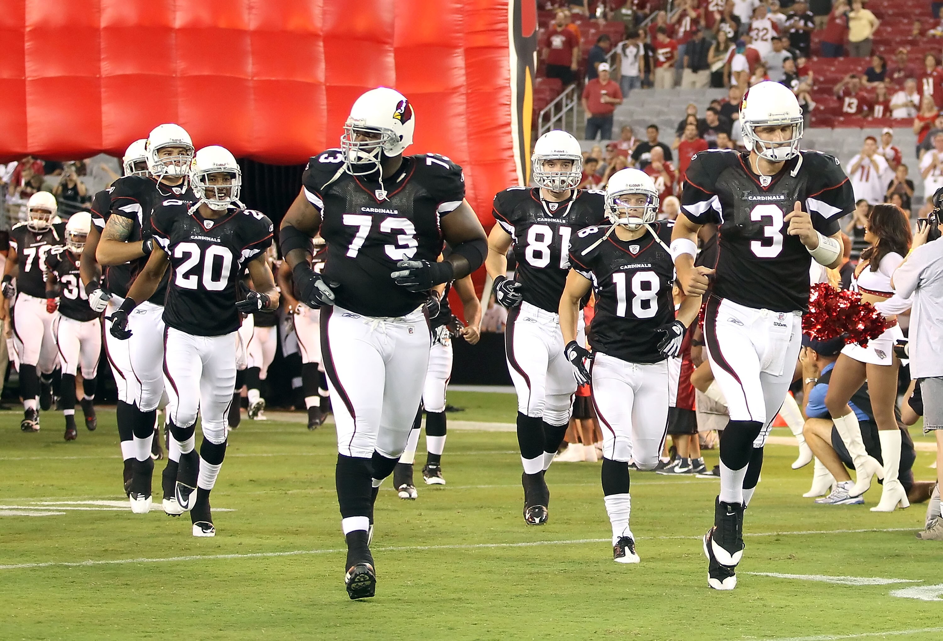 GLENDALE, AZ - SEPTEMBER 02:  Quarterback Derek Anderson #3 of the Arizona Cardinals leads teammates out onto the field before the preseason NFL game against the Washington Redskins at the University of Phoenix Stadium on September 2, 2010 in Glendale, Ar