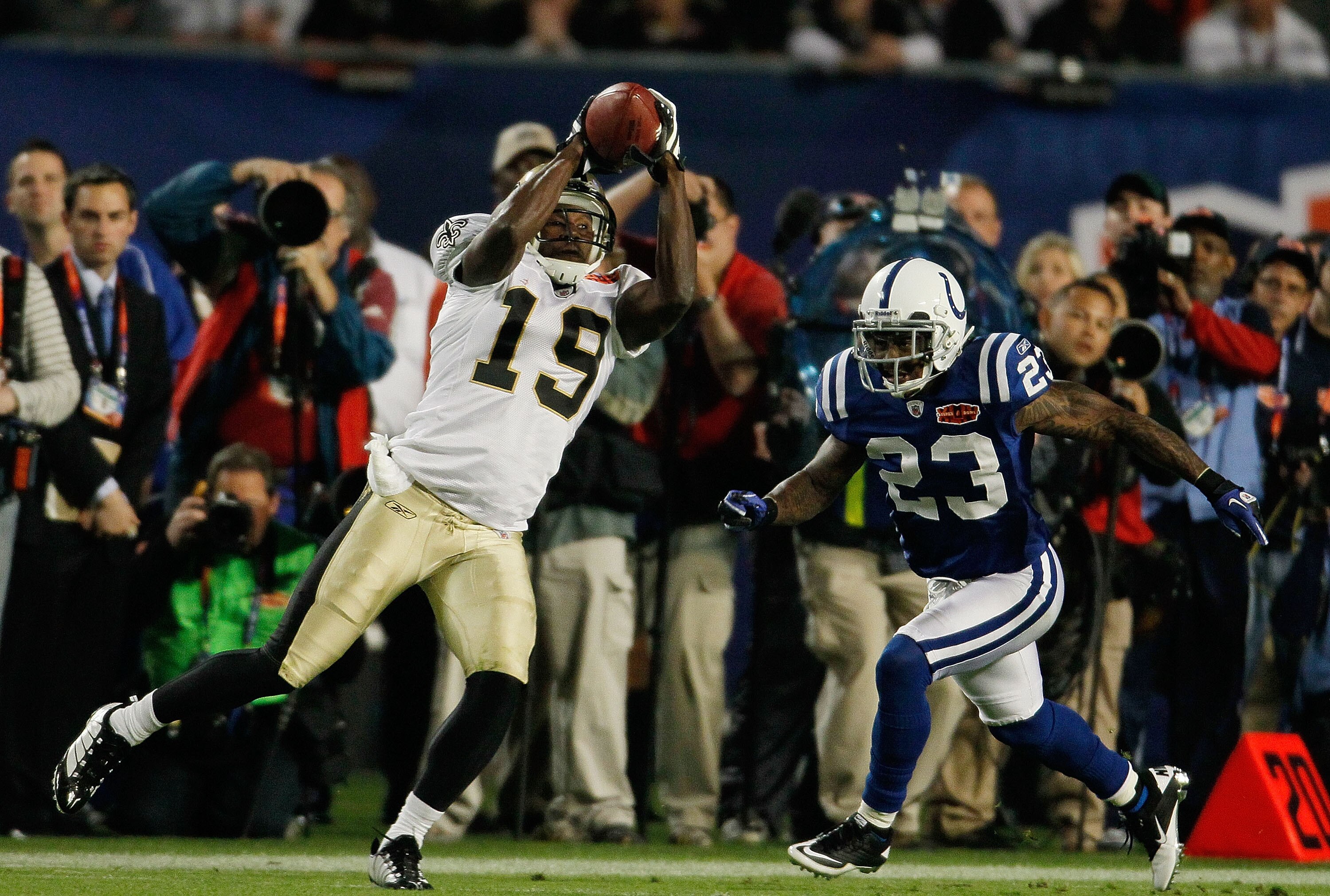 MIAMI GARDENS, FL - FEBRUARY 07: Devery Henderson #19 of the New Orleans Saints goes up for a ball against Tim Jennings #23 of the Indianapolis Colts during Super Bowl XLIV on February 7, 2010 at Sun Life Stadium in Miami Gardens, Florida.  (Photo by Dona