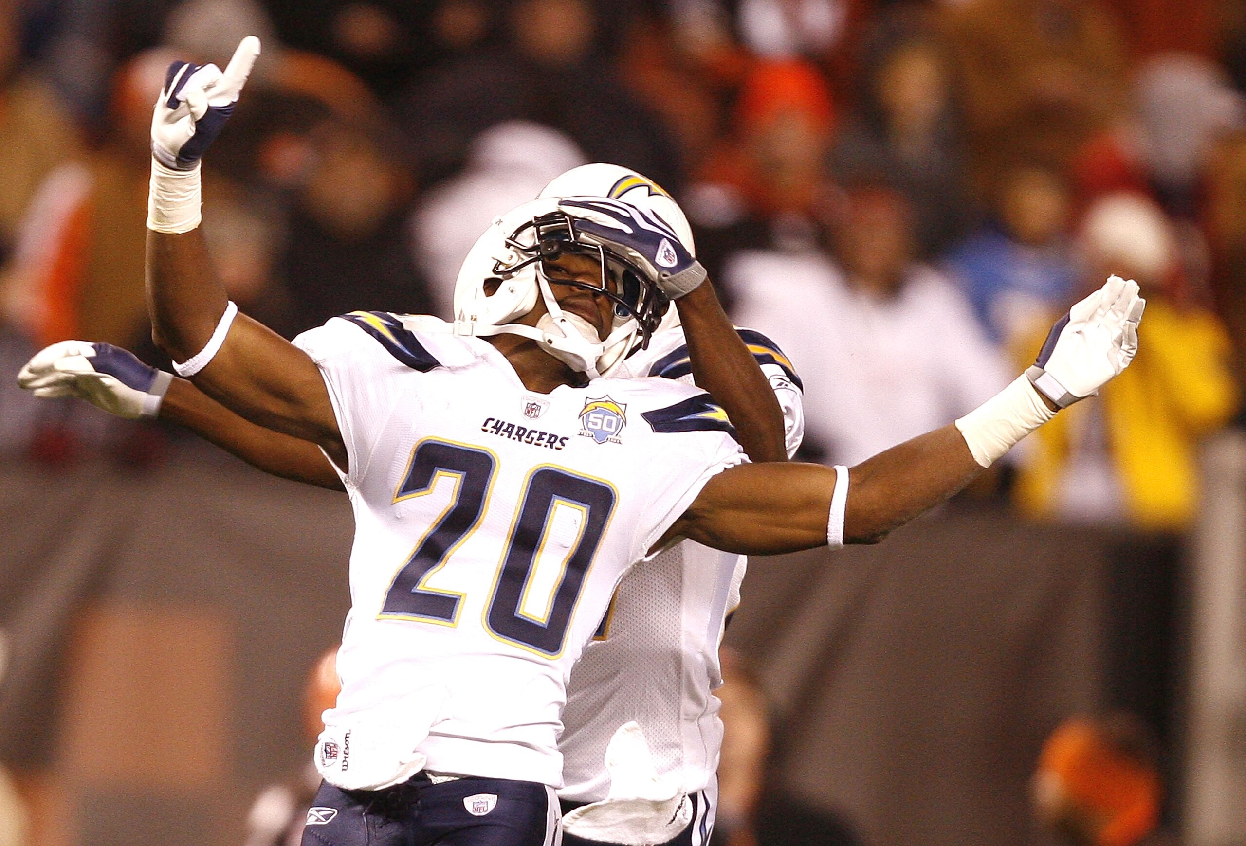 CLEVELAND - DECEMBER 06:  Antoine Cason #20 of the San Diego Chargers celebrates with teammate Paul Oliver #27 after a play against the Cleveland Browns at Cleveland Browns Stadium on December 6, 2009 in Cleveland, Ohio.  (Photo by Matt Sullivan/Getty Ima