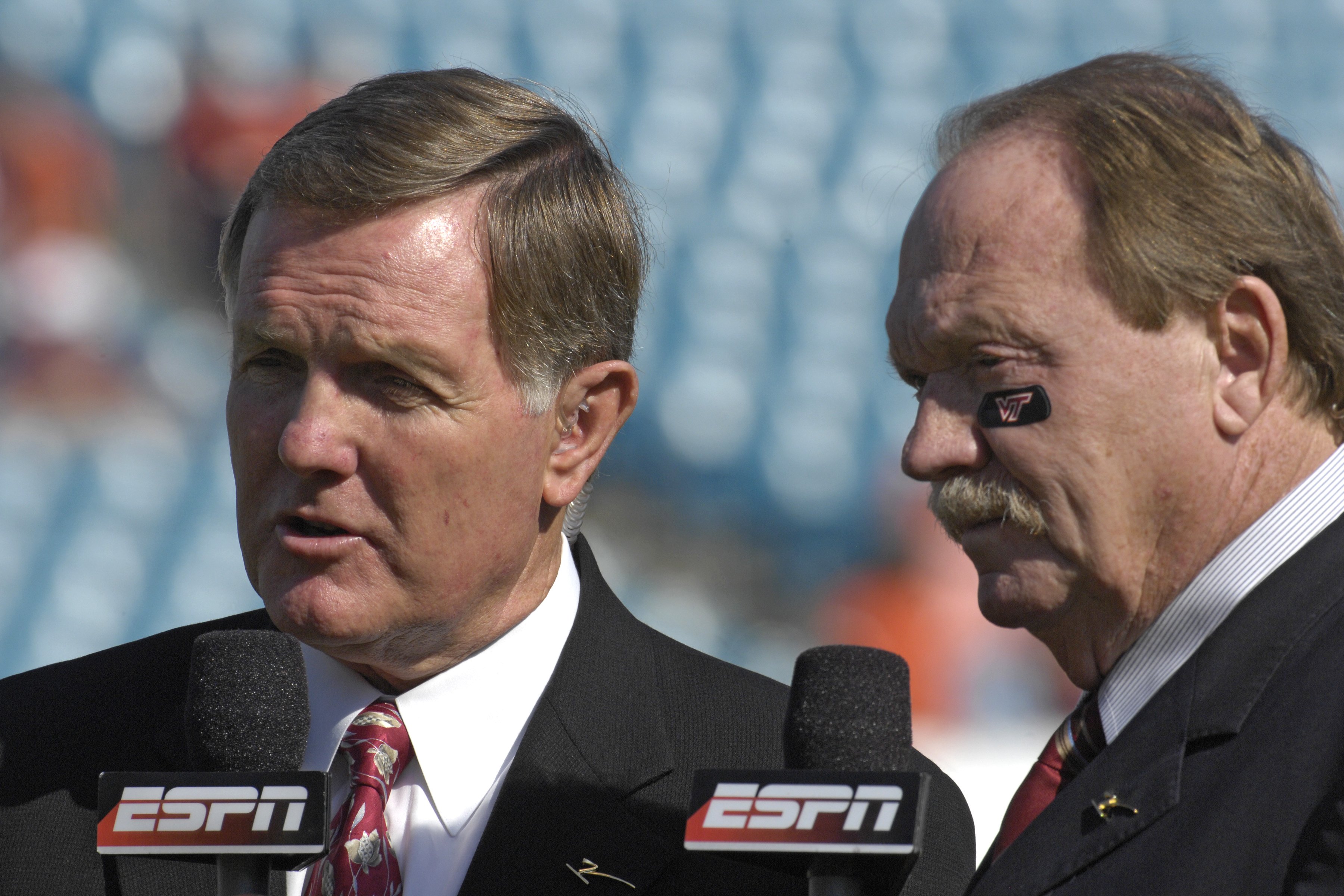 JACKSONVILLE, FL - DECEMBER 1: ESPN commentators Bob Griese (left) and Paul Maguire report from the sidelines as the Boston College Eagles battle the Virginia Tech Hokies in the ACC Championship Game at Jacksonville Municipal Stadium on December 1, 2007 i