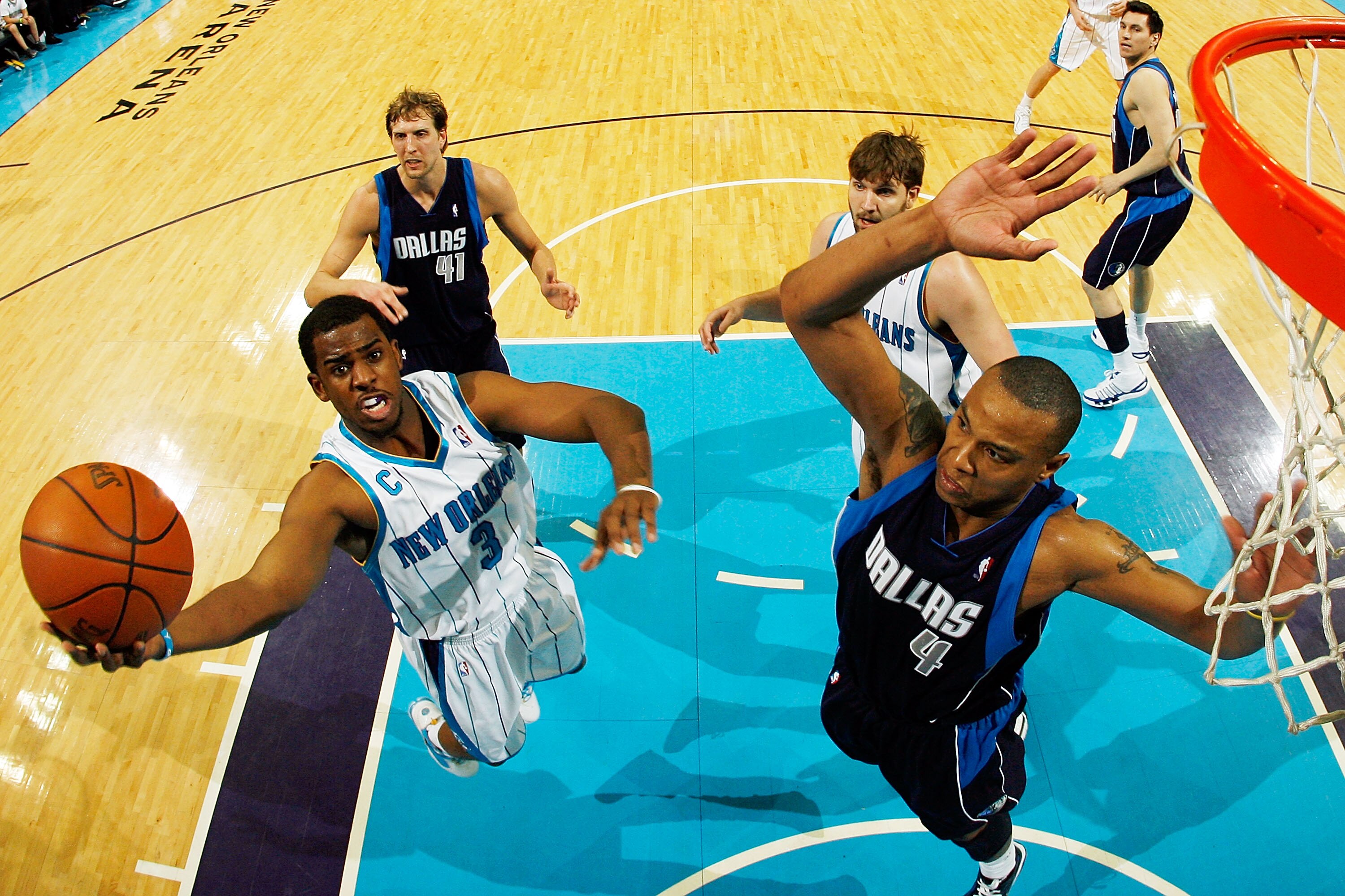 NEW ORLEANS - MARCH 22:  Chris Paul #3 of the New Orleans Hornets shoots the ball over Caron Butler #4 of the Dallas Mavericks at the New Orleans Arena on March 22, 2010 in New Orleans, Louisiana.  The Hornets defeated the Mavericks 115-99.  NOTE TO USER:
