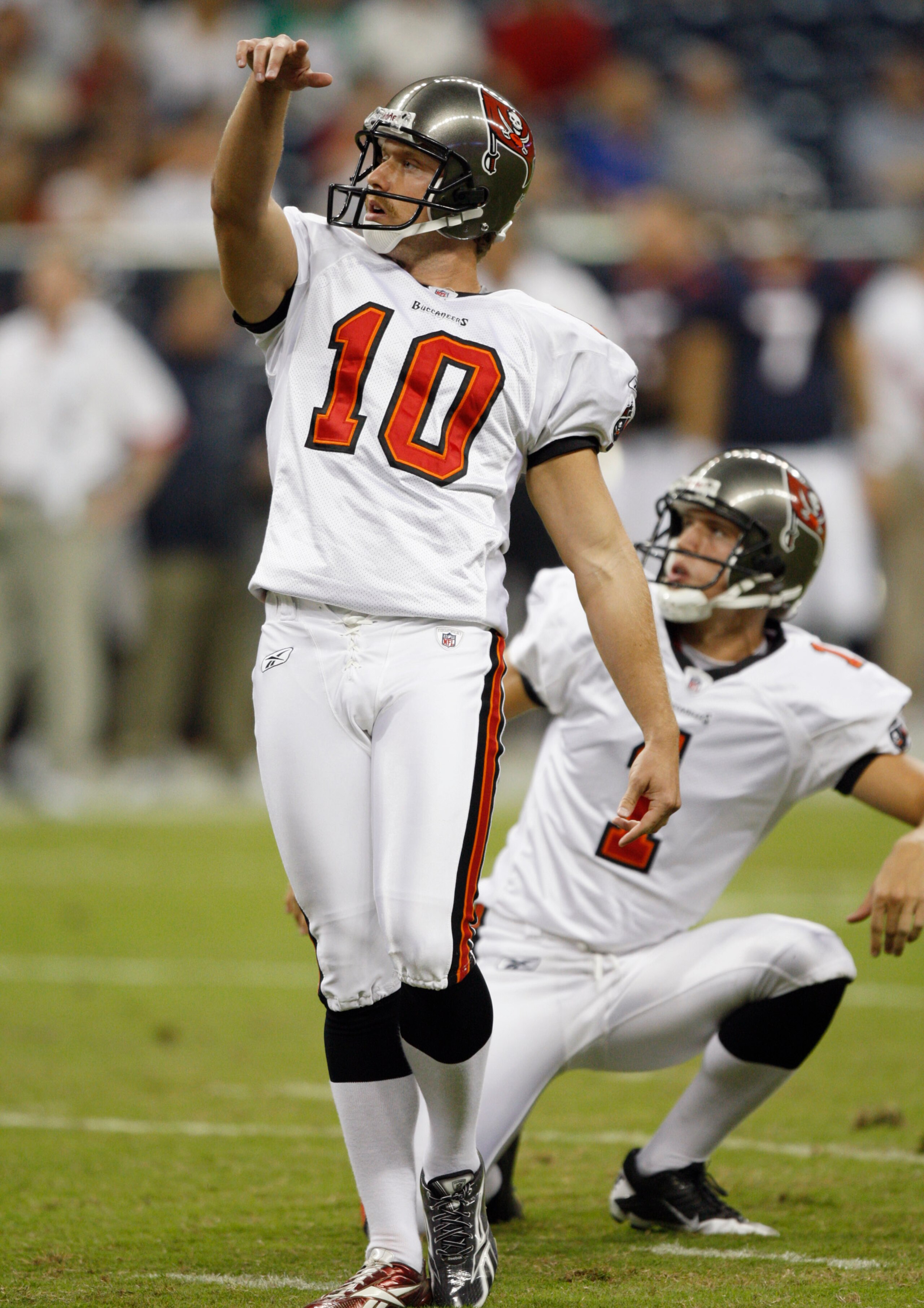 HOUSTON - SEPTEMBER 02:  Kicker Connor Barth #10 of the Tampa Bay Buccaneers kicks a 38-yard field goal out of the hold of teammate Brent Bowden #1 during a preseason football game against the Houston Texans at Reliant Stadium on September 2, 2010 in Hous