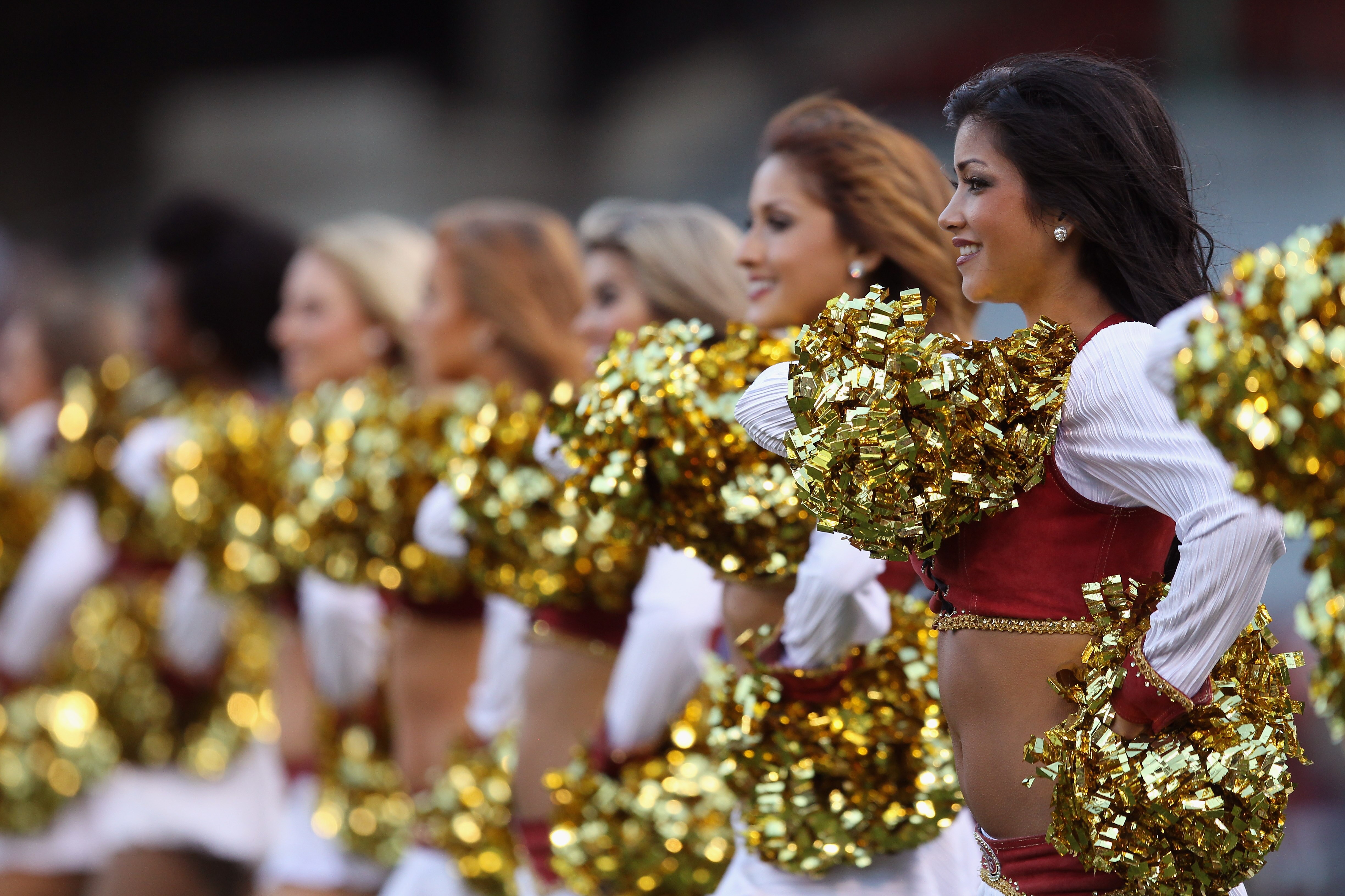 SAN FRANCISCO - SEPTEMBER 02:  The San Francisco 49ers' Gold Rush cheerleaders cheer during their game against the San Diego Chargers at Candlestick Park  on September 2, 2010 in San Francisco, California.  (Photo by Ezra Shaw/Getty Images)