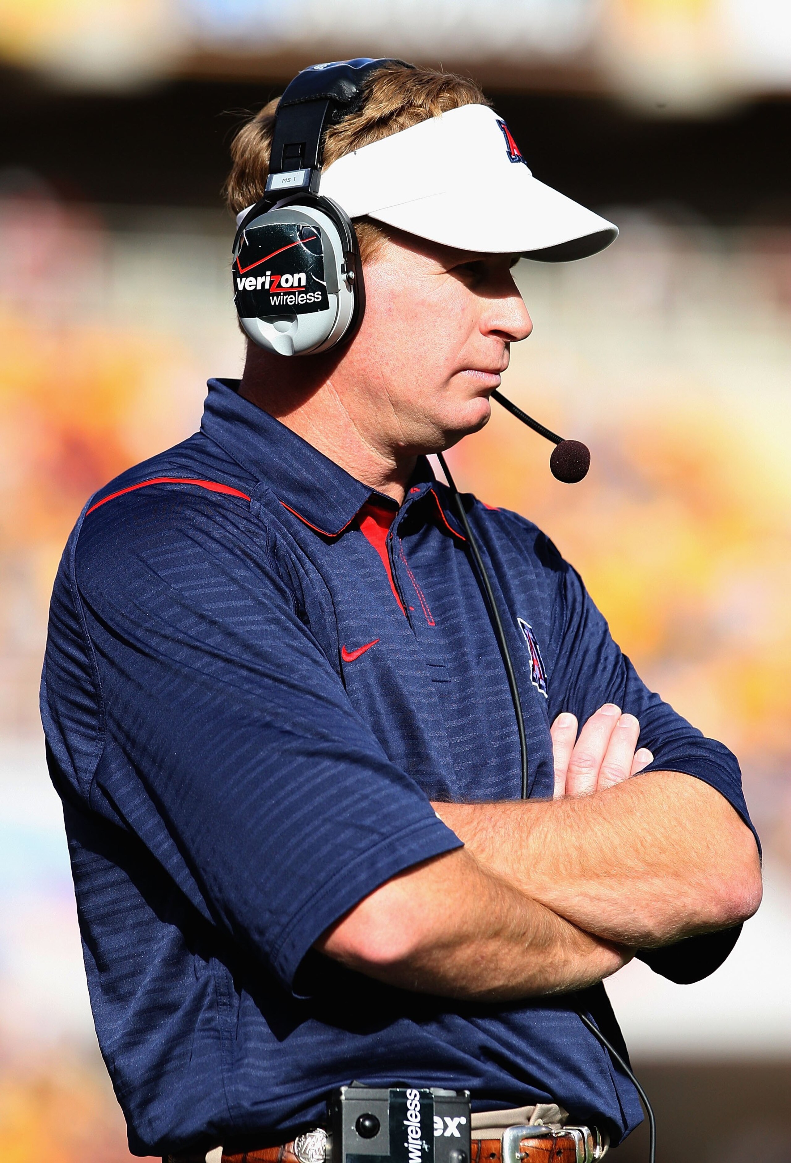 TEMPE, AZ - NOVEMBER 28: Head coach Mike Stoops of the Arizona Wildcats walks the sidelines during the college football game against the Arizona State Sun Devils at Sun Devil Stadium on November 28, 2009 in Tempe, Arizona. The Wildcats defeated the Sun D TEMPE, AZ - NOVEMBER 28: Head coach Mike Stoops of the Arizona Wildcats walks the sidelines during the college football game against the Arizona State Sun Devils at Sun Devil Stadium on November 28, 2009 in Tempe, Arizona. The Wildcats defeated the Sun D