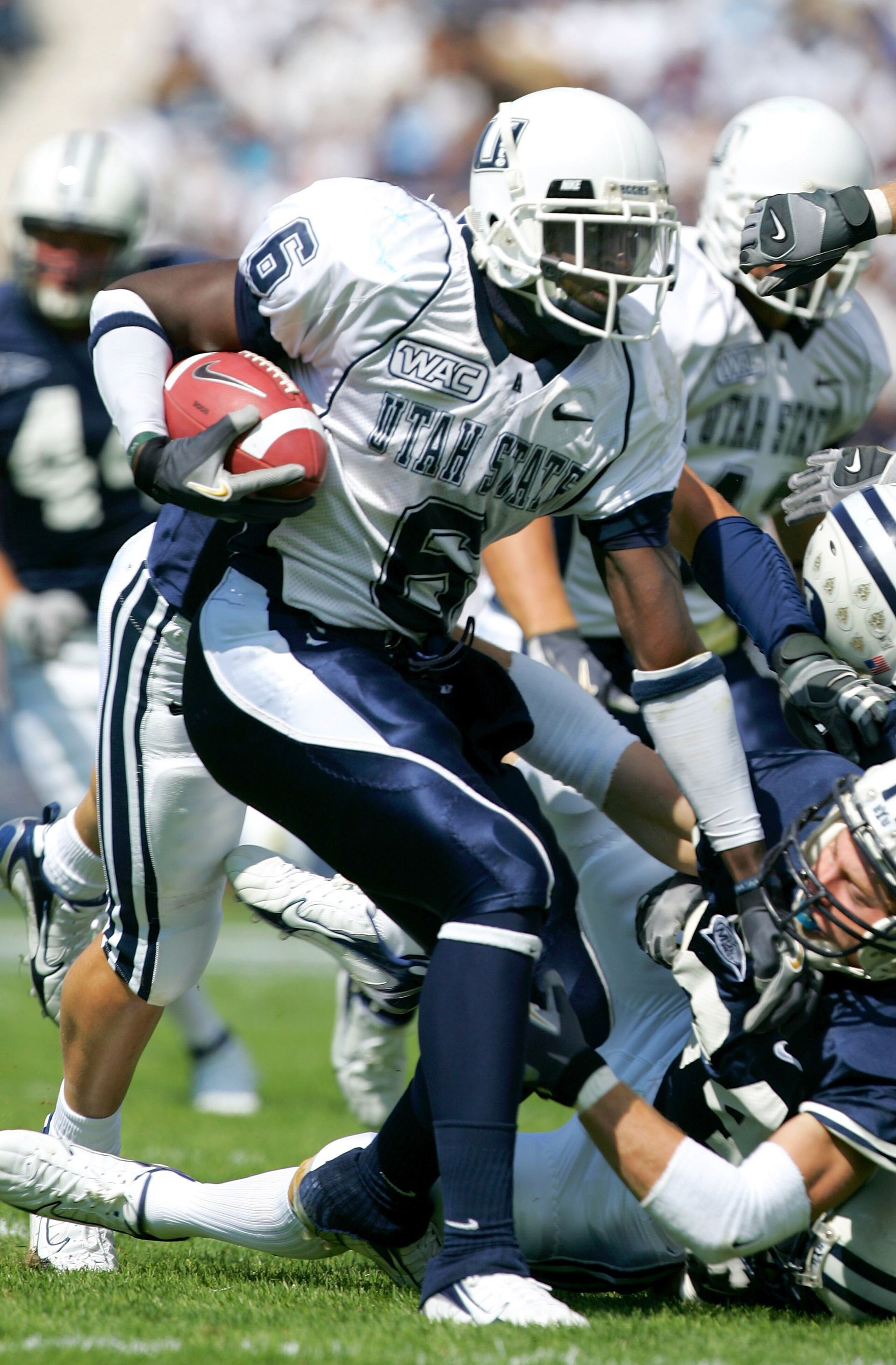 PROVO, UT - SEPTEMBER 23: Kevin Robinson #6 of the Utah State Aggies runs with the ball against the Brigham Young Cougars on September 23, 2006 at La Vell Edwards Stadium in Provo, Utah. (Photo By Kent Horner/Getty Images) PROVO, UT - SEPTEMBER 23: Kevin Robinson #6 of the Utah State Aggies runs with the ball against the Brigham Young Cougars on September 23, 2006 at La Vell Edwards Stadium in Provo, Utah. (Photo By Kent Horner/Getty Images)