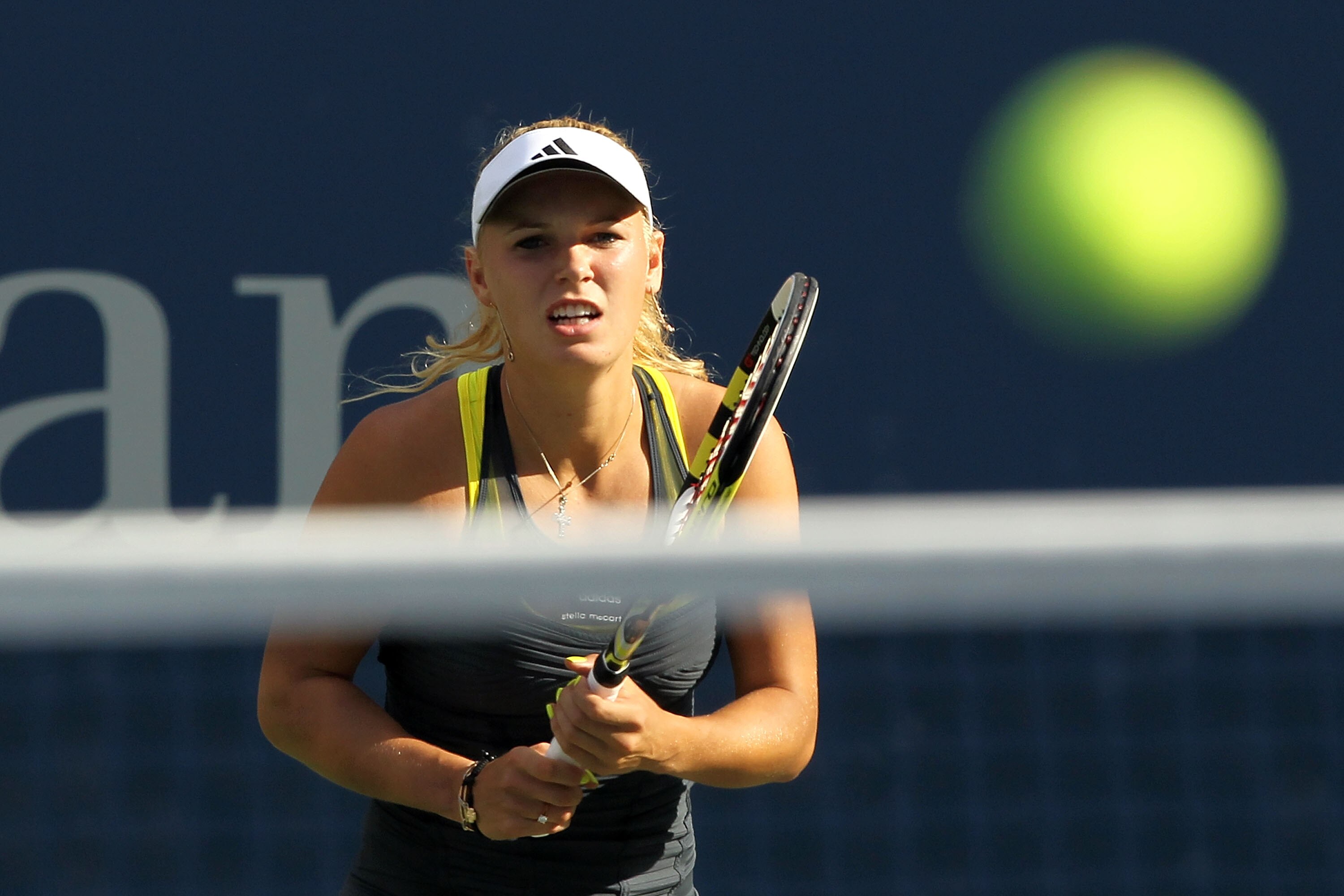 NEW YORK - SEPTEMBER 06:  Caroline Wozniacki of Denmark awaits the return shot against Maria Sharapova of Russia during the women's singles match on day eight of the 2010 U.S. Open at the USTA Billie Jean King National Tennis Center on September 6, 2010 i