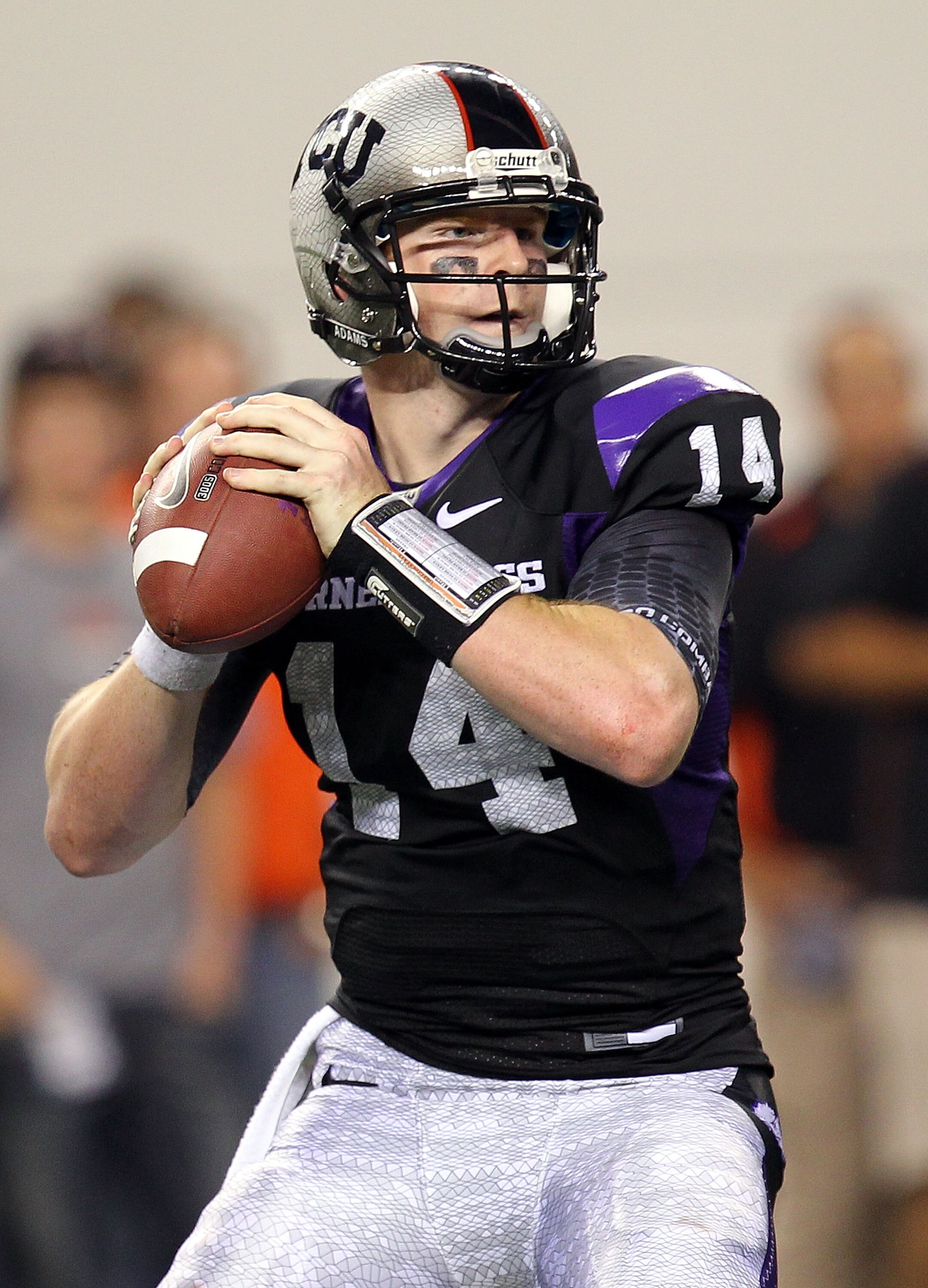ARLINGTON, TX - SEPTEMBER 04:  Quarterback Andy Dalton #14 of the TCU Horned Frogs drops back to pass against the Oregon State Beavers at Cowboys Stadium on September 4, 2010 in Arlington, Texas.  (Photo by Ronald Martinez/Getty Images)