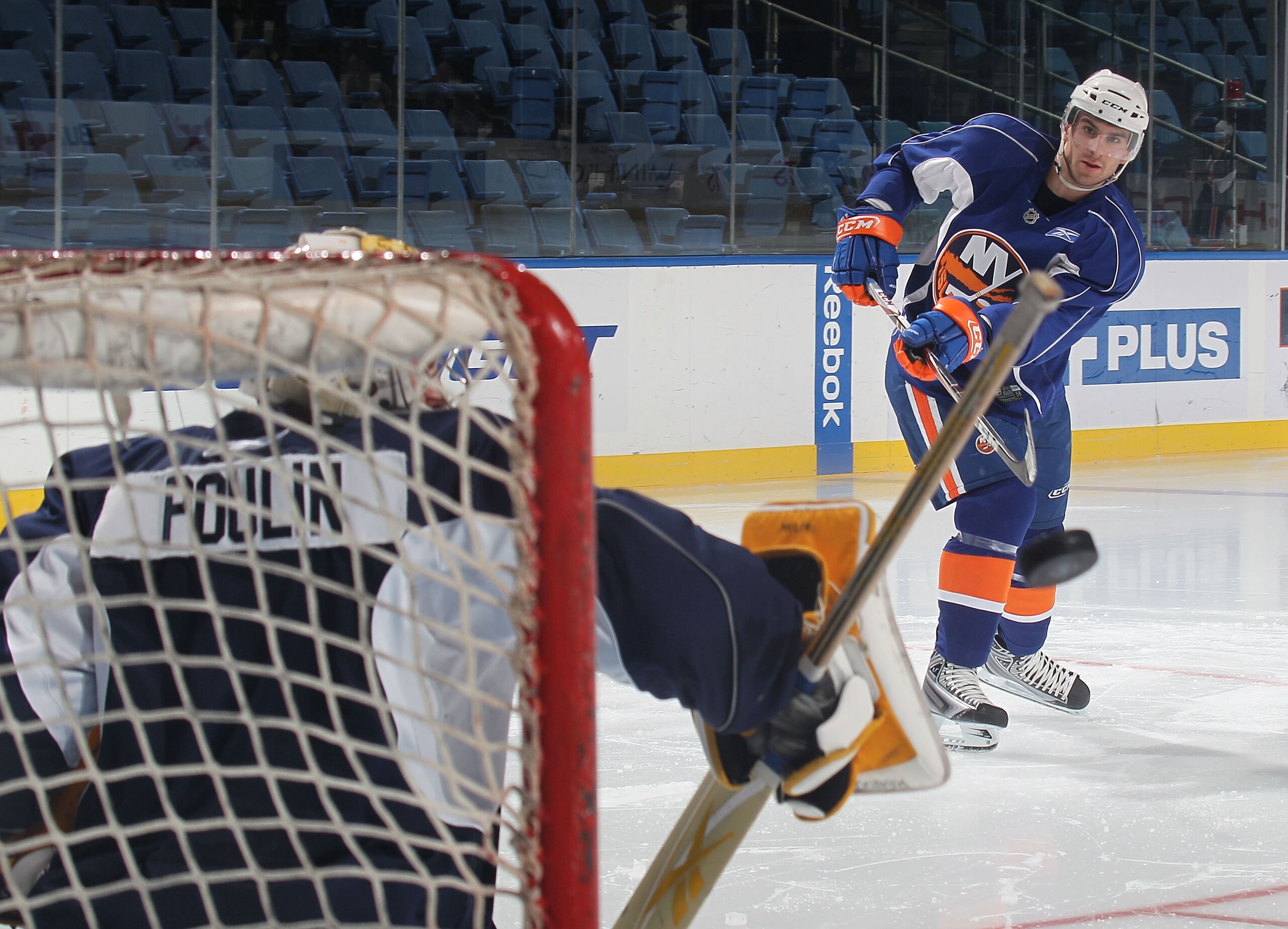 UNIONDALE, NY - JULY 07: John Tavares sends a shot at Kevin Poulin during the New York Islanders rookie camp at Nassau Veterans Memorial Coliseum on July 7, 2010 in Uniondale, New York.  (Photo by Bruce Bennett/Getty Images)