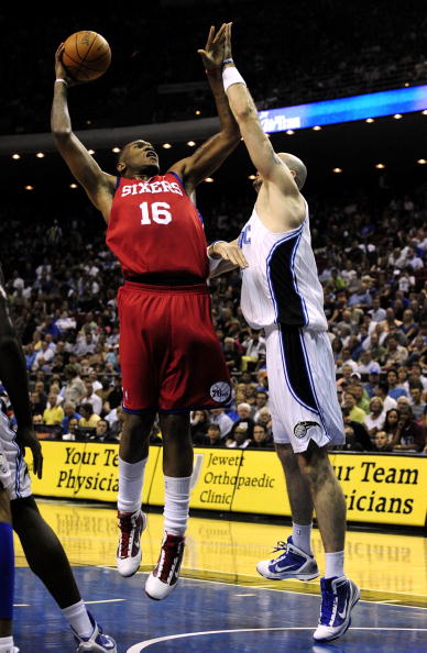 ORLANDO, FL - OCTOBER 28:  Marreese Speights #16 of the Philadelphia 76ers goes up for a shot against Marcin Gortat #13 of the Orlando Magic during the game on October 28, 2009 at Amway Arena in Orlando, Florida.  NOTE TO USER: User expressly acknowledges