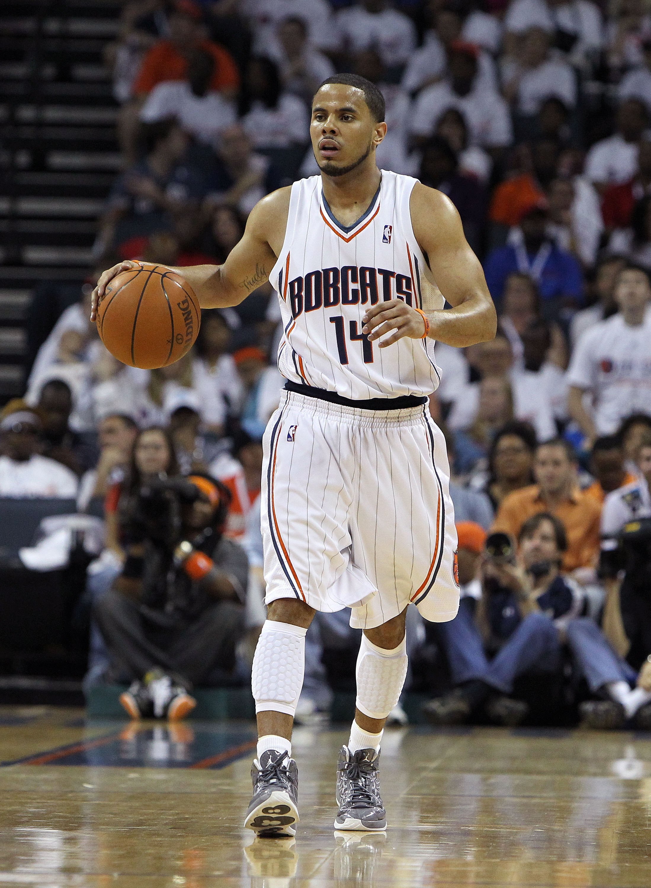 CHARLOTTE - APRIL 24:  Guard D.J. Augustin #14 of the Charlotte Bobcats dribbles the ball upcourt during Game Three of the Eastern Conference Quarterfinals against the Orlando Magic during the 2010 NBA Playoffs at Time Warner Cable Arena on April 24, 2010