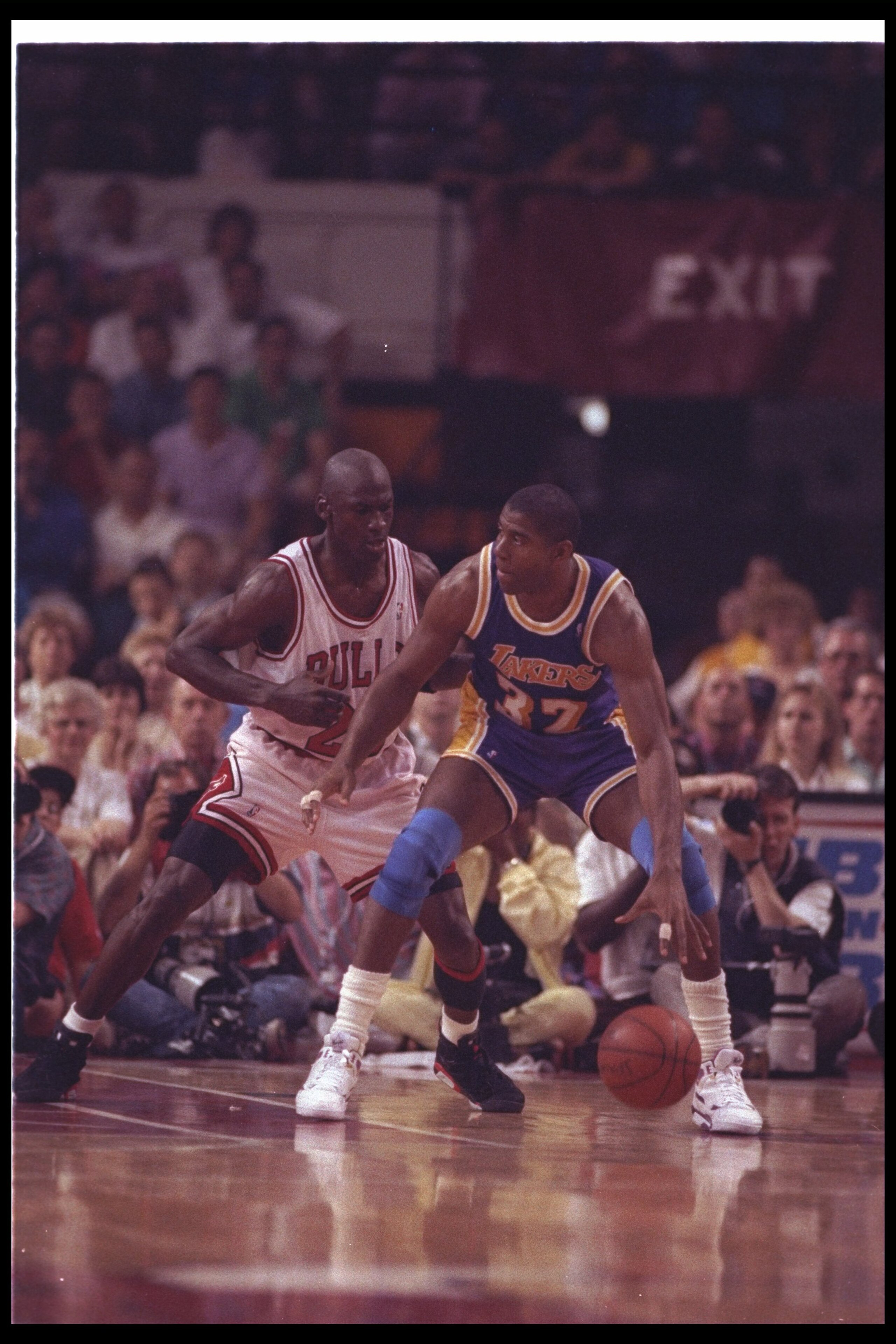 2 May 1991:  Guard Michael Jordan of the Chicago Bulls (left) and guard Magic Johnson of the Los Angeles Lakers fight for the ball during Game One of the NBA finals at the United Center in Chicago, Illinois.  The Lakers won the game, 93-91. Mandatory Cred