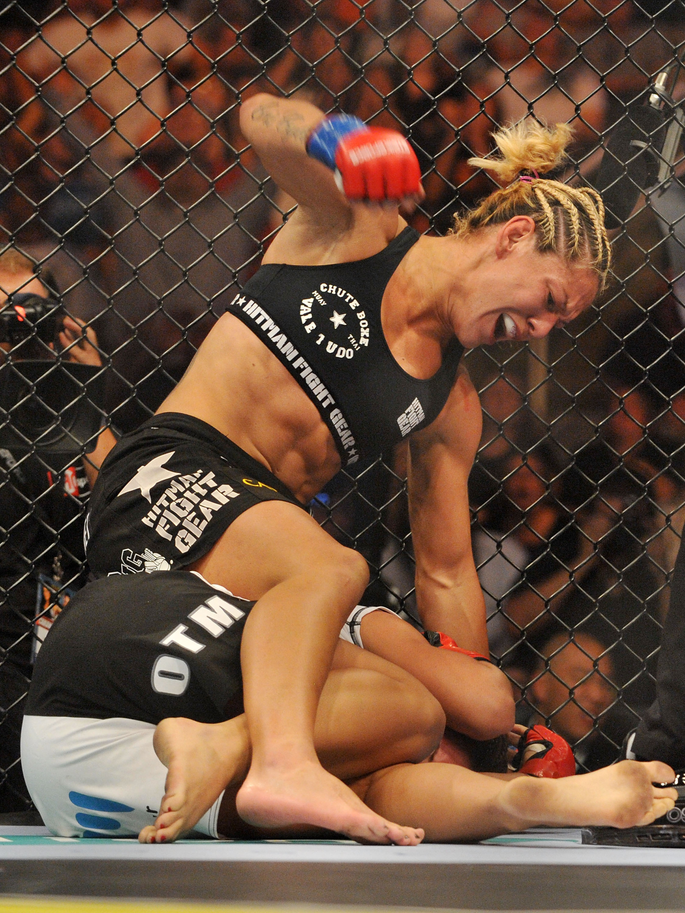 SAN JOSE, CA - AUGUST 15:  Cris Cyborg (Top) battles Gina Carano during their Middleweight  Championship fight at Stikeforce: Carano vs. Cyborg on August 15, 2009 in San Jose, California.  (Photo by Jon Kopaloff/Getty Images)