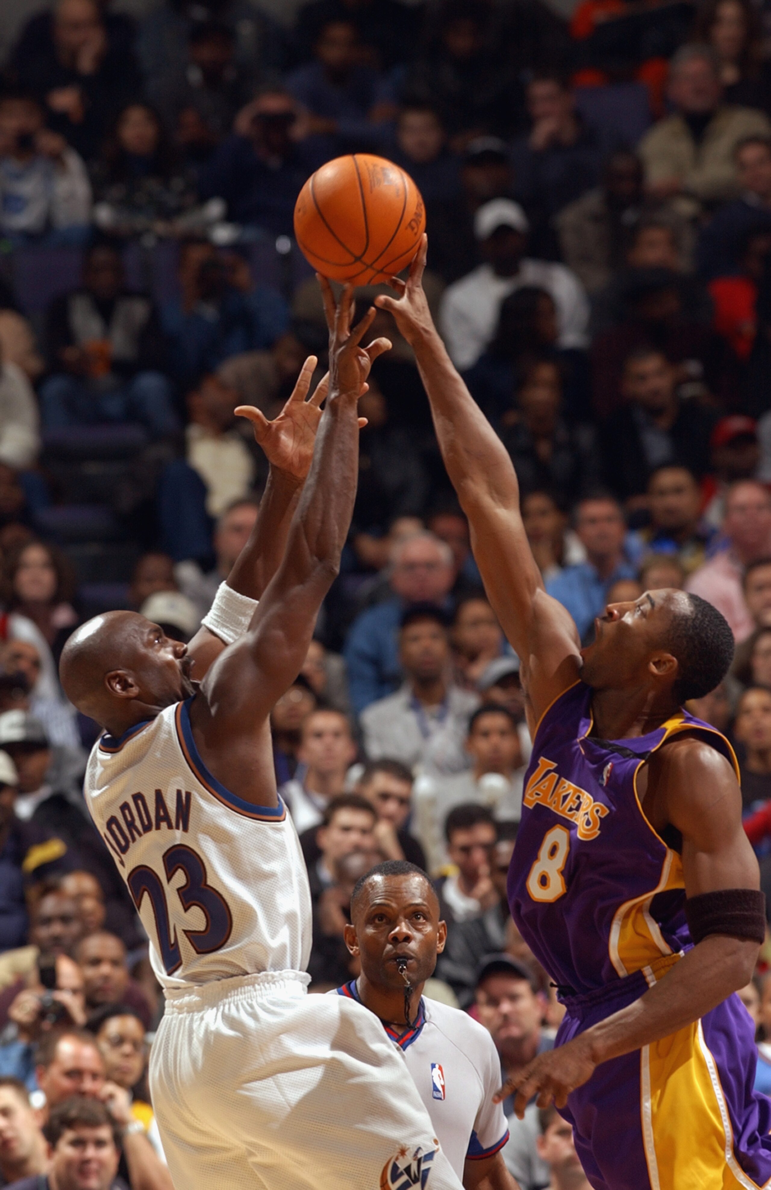WASHINGTON - NOVEMBER 8:  Michael Jordan #23 of the Washington Wizards attempts to shoot the ball over Kobe Bryant #8 of the Los Angeles Lakers during the game at MCI Center on November 8, 2002 in Washington, D.C.  The Wizards won 100-99.  NOTE TO USER: U