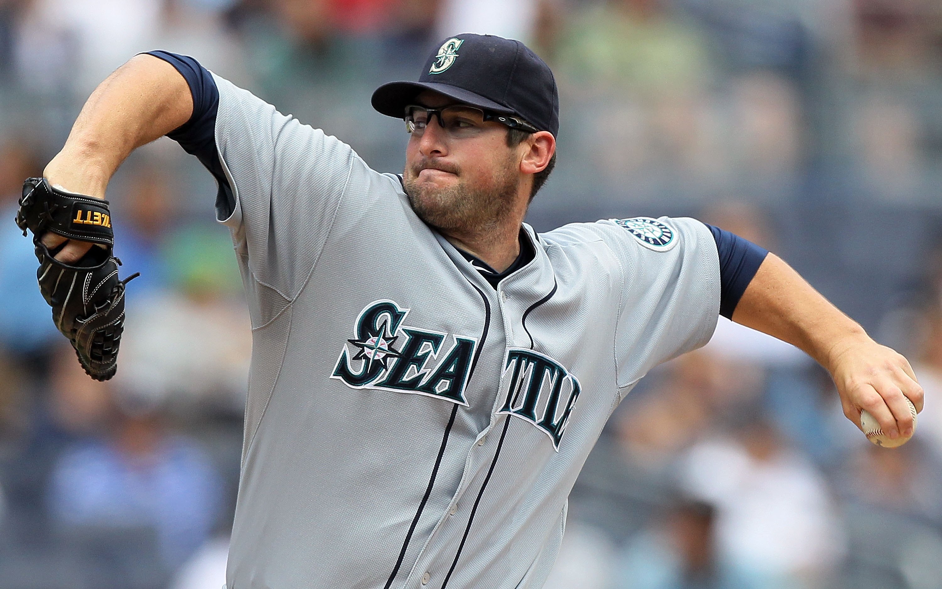 NEW YORK - JULY 01:  Ryan Rowland-Smith #18 of the Seattle Mariners delivers a pitch against the New York Yankees on July 1, 2010 at Yankee Stadium in the Bronx borough of New York City.  (Photo by Jim McIsaac/Getty Images)