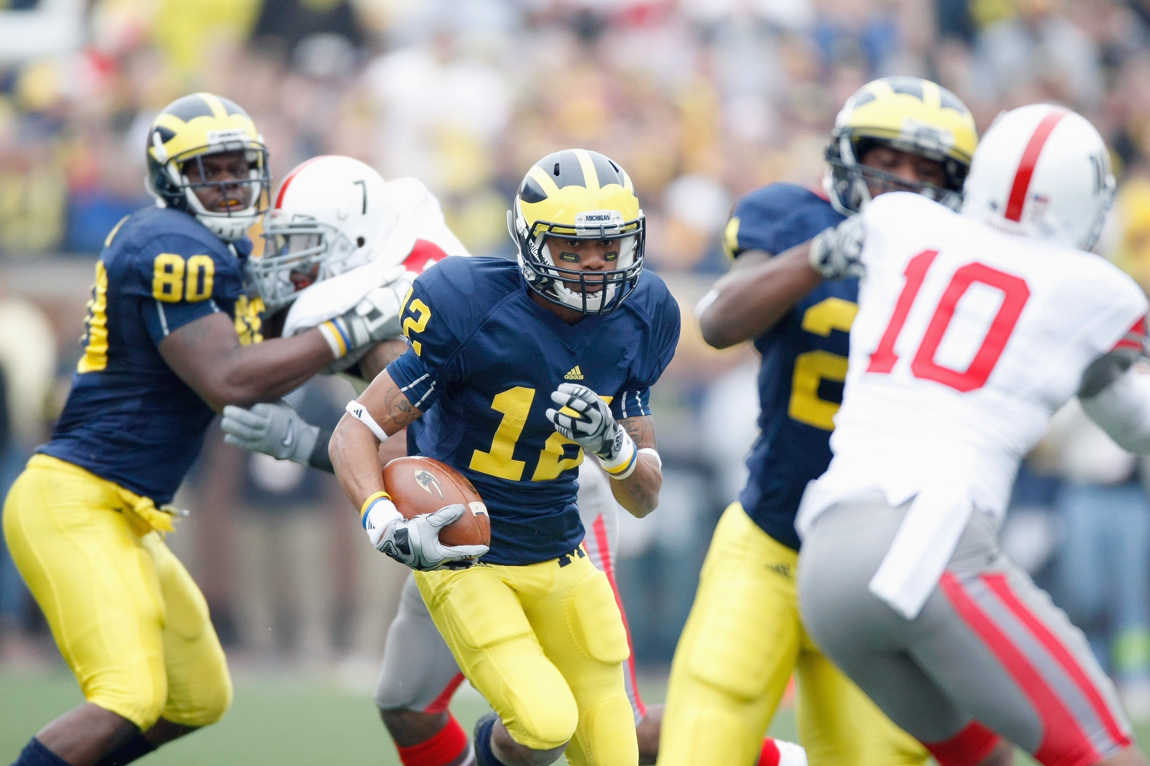 ANN ARBOR, MI - NOVEMBER 21: Roy Roundtree #12 of the Michigan Wolverines carries the ball during the game against the Ohio State Buckeyes on November 21, 2009 at Michigan Stadium in Ann Arbor, Michigan. Ohio State won the game 21-10. (Photo by Gregory Sh ANN ARBOR, MI - NOVEMBER 21: Roy Roundtree #12 of the Michigan Wolverines carries the ball during the game against the Ohio State Buckeyes on November 21, 2009 at Michigan Stadium in Ann Arbor, Michigan. Ohio State won the game 21-10. (Photo by Gregory Sh