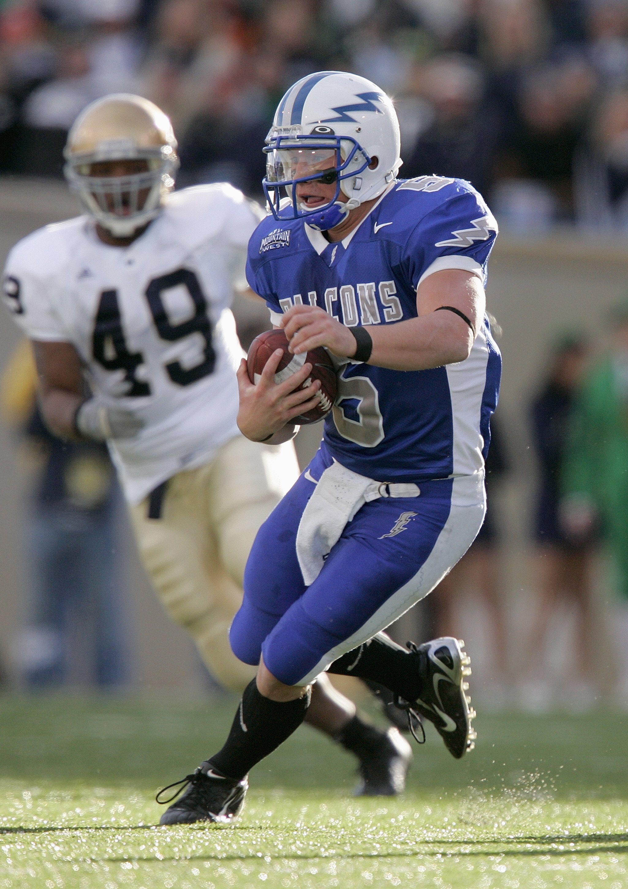 AIR FORCE ACADEMY, CO - NOVEMBER 11: Quarterabck Shaun Carney #5 of the Air Force Falcons carries the ball during the game against the Notre Dame Fighting Irish on November 11, 2006 at Falcon Stadium on the Air Force Academy near Colorado Springs, Colora AIR FORCE ACADEMY, CO - NOVEMBER 11: Quarterabck Shaun Carney #5 of the Air Force Falcons carries the ball during the game against the Notre Dame Fighting Irish on November 11, 2006 at Falcon Stadium on the Air Force Academy near Colorado Springs, Colora