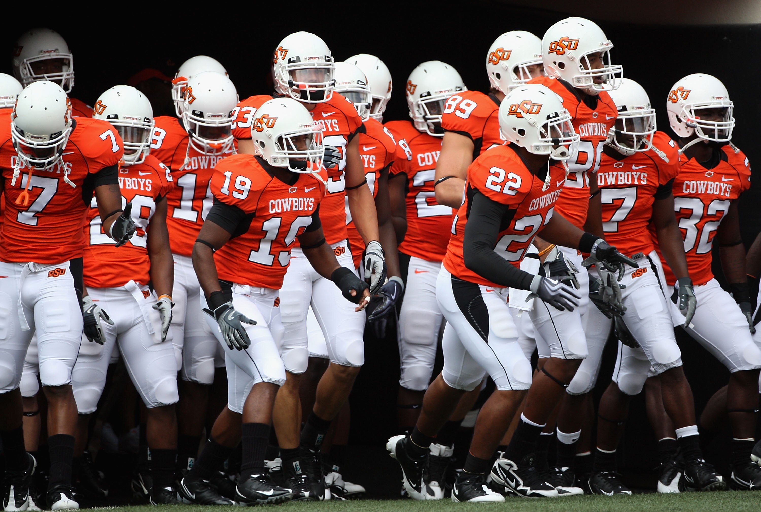 STILLWATER, OK - SEPTEMBER 05: The Oklahoma State Cowboys run out onto the field before the college football game at Boone Pickens Stadium on September 5, 2009 in Stillwater, Oklahoma. The Cowboys defeated the Bulldogs 24-10. (Photo by Christian Peters STILLWATER, OK - SEPTEMBER 05: The Oklahoma State Cowboys run out onto the field before the college football game at Boone Pickens Stadium on September 5, 2009 in Stillwater, Oklahoma. The Cowboys defeated the Bulldogs 24-10. (Photo by Christian Peters