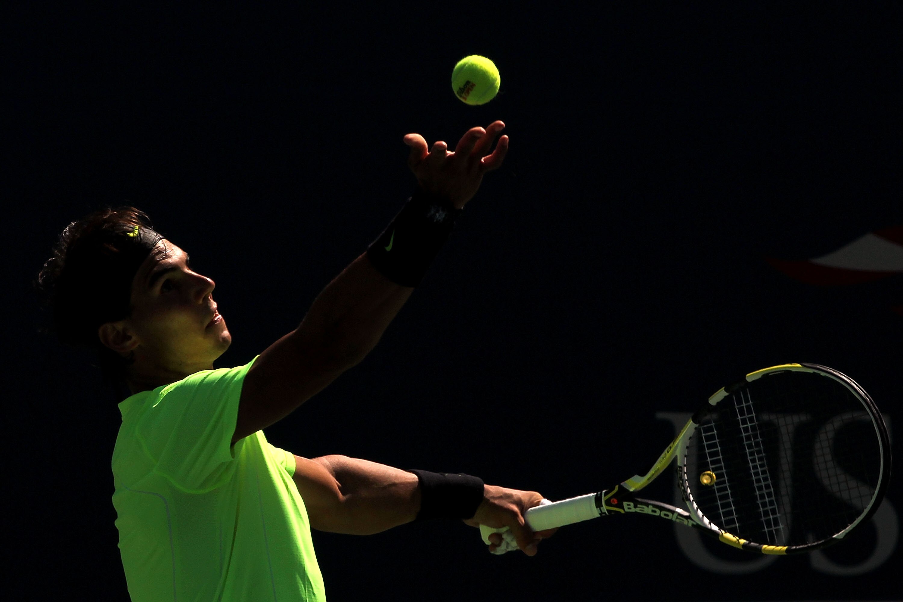 NEW YORK - SEPTEMBER 11:  Rafael Nadal of Spain serves against Mikhail Youzhny of Russia during his men's singles semifinal match on day thirteen of the 2010 U.S. Open at the USTA Billie Jean King National Tennis Center on September 11, 2010 in the Flushi