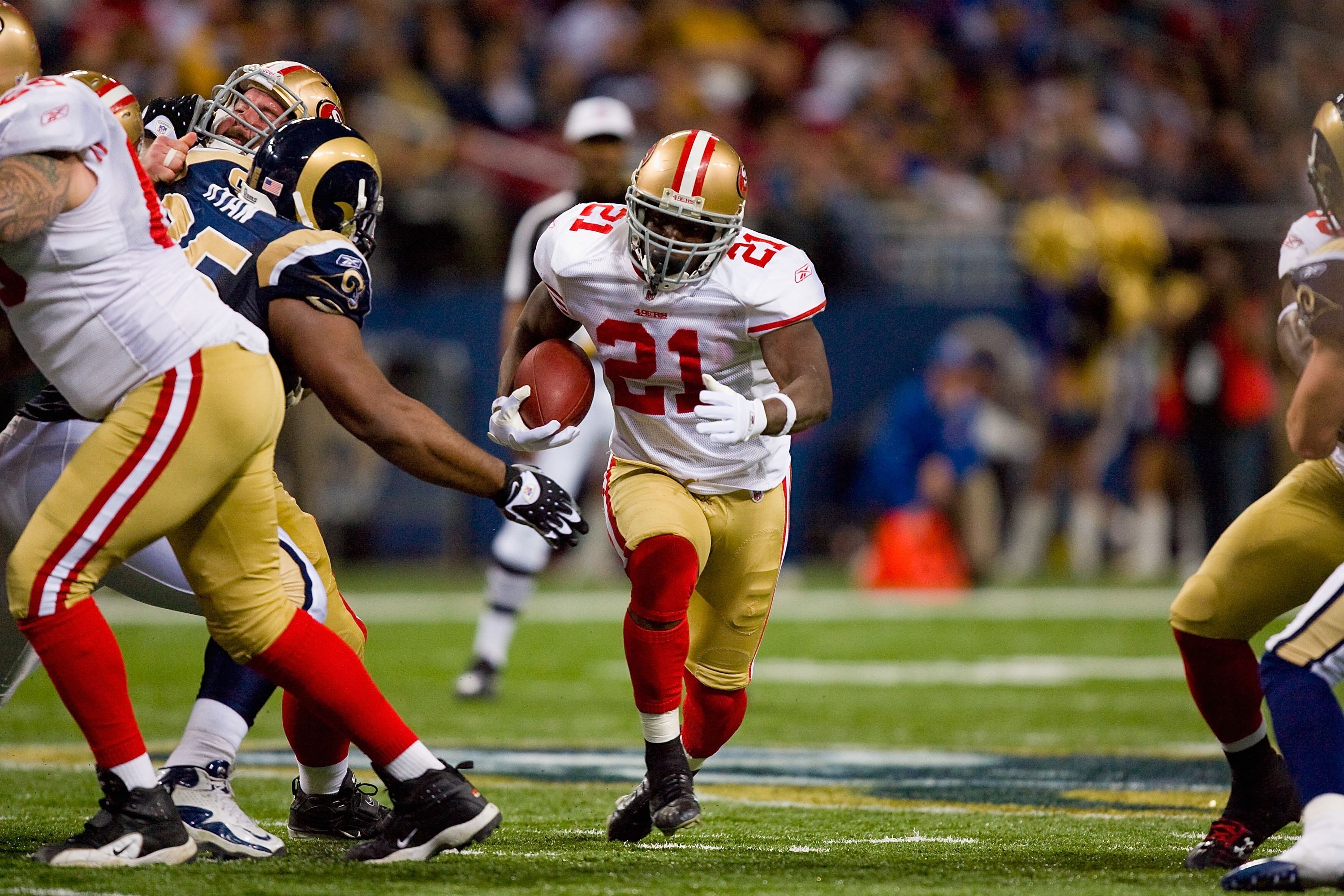 ST. LOUIS - JANUARY 3:  Frank Gore #21 of the San Francisco 49ers carries the ball during the game against the St. Louis Rams at the Edward Jones Dome on January 3, 2010 in St. Louis, Missouri.  The 49ers beat the Rams 28-6.  (Photo by Dilip Vishwanat/Get