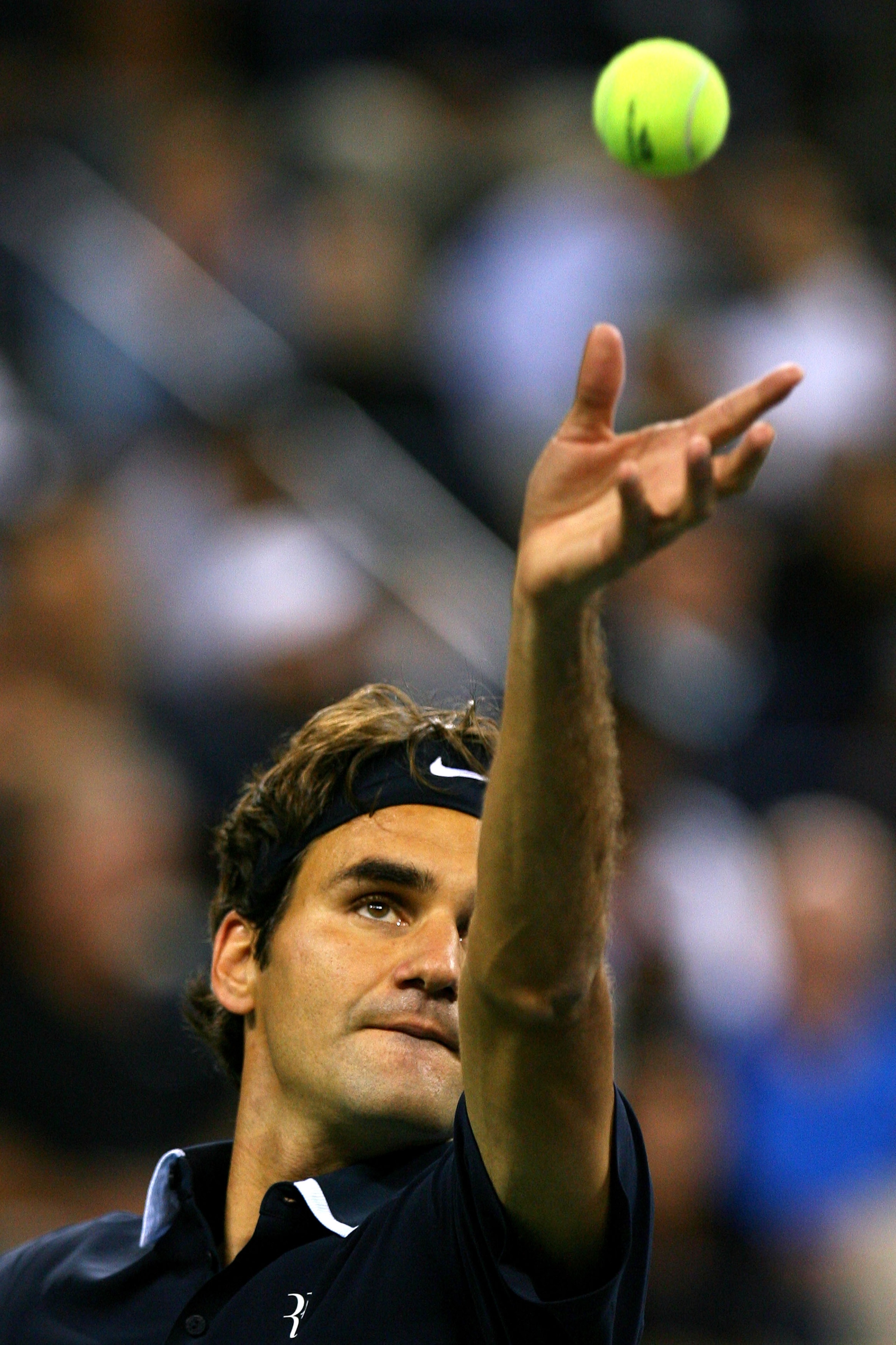 NEW YORK - SEPTEMBER 08:   Roger Federer of Switzerland serves against Robin Soderling of Sweden during his men's singles quarterfinal match on day ten of the 2010 U.S. Open at the USTA Billie Jean King National Tennis Center on September 8, 2010 in the F