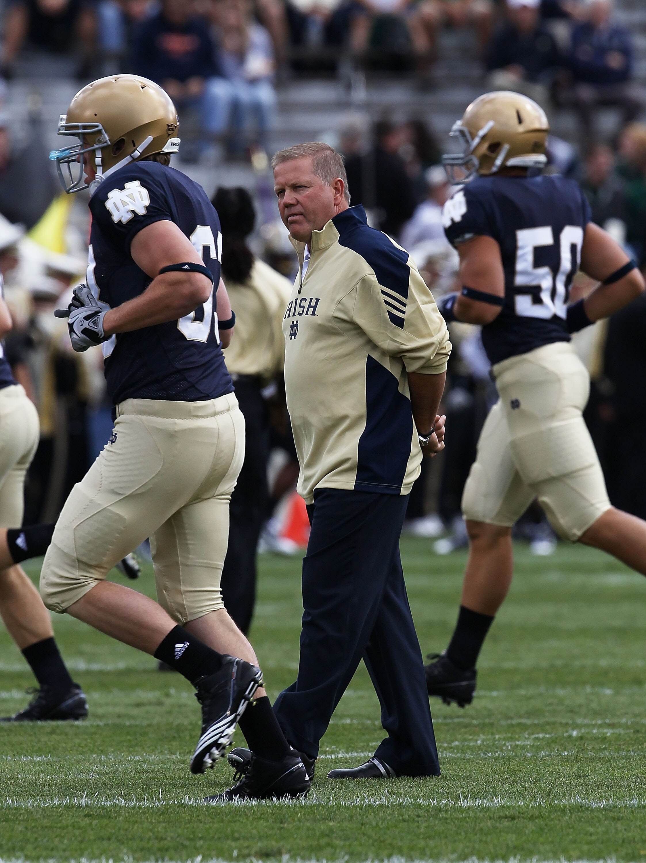 SOUTH BEND, IN - SEPTEMBER 04: Head coach Brian Kelly of the Notre Dame Fighting Irish watches his team during warm-ups before taking on the Purdue Boilermakers at Notre Dame Stadium on September 4, 2010 in South Bend, Indiana. Notre Dame defeated Purdue