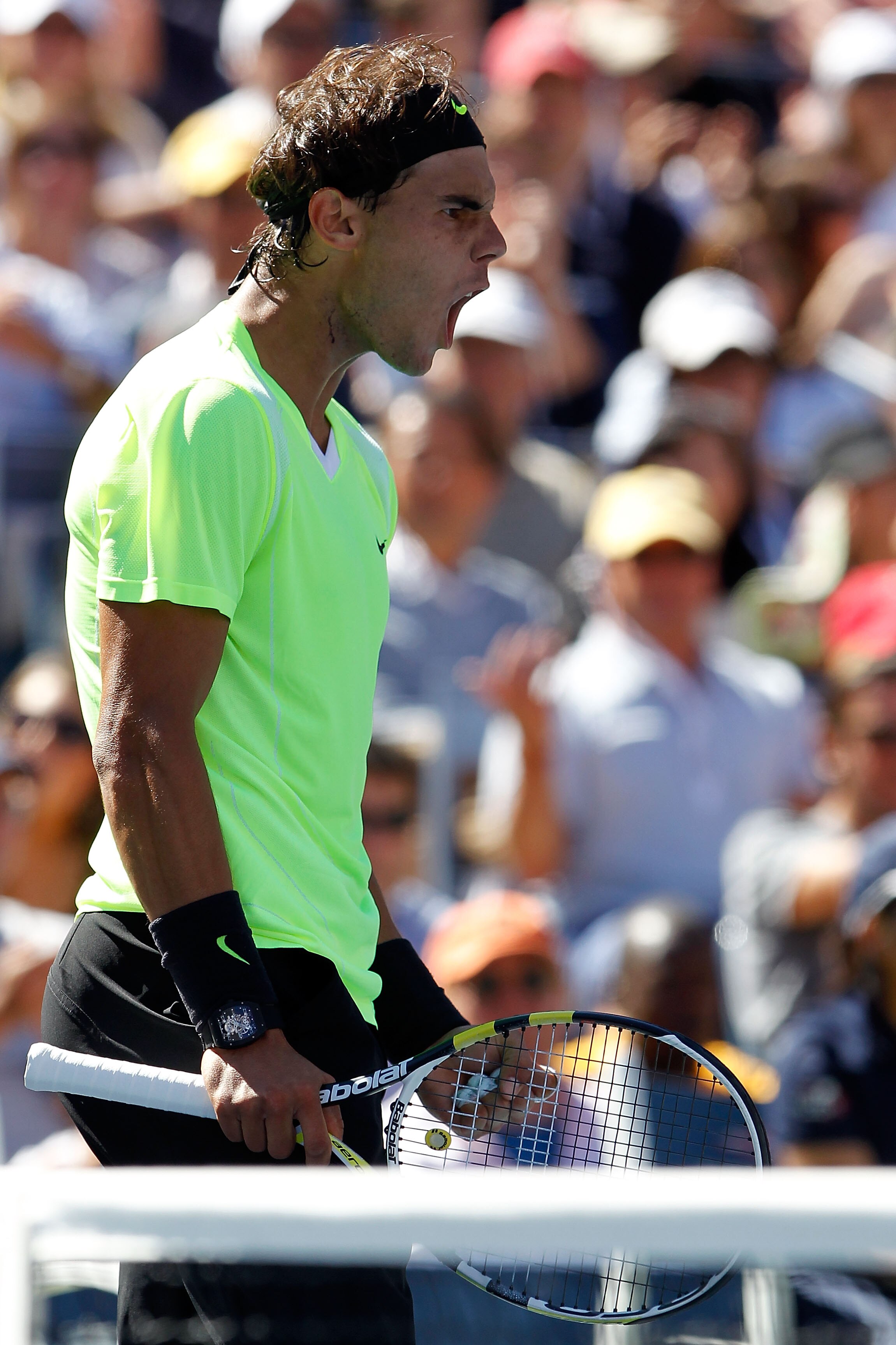 NEW YORK - SEPTEMBER 11:  Rafael Nadal of Spain celebrates defeating Mikhail Youzhny of Russia during his men's singles semifinal match on day thirteen of the 2010 U.S. Open at the USTA Billie Jean King National Tennis Center on September 11, 2010 in the 