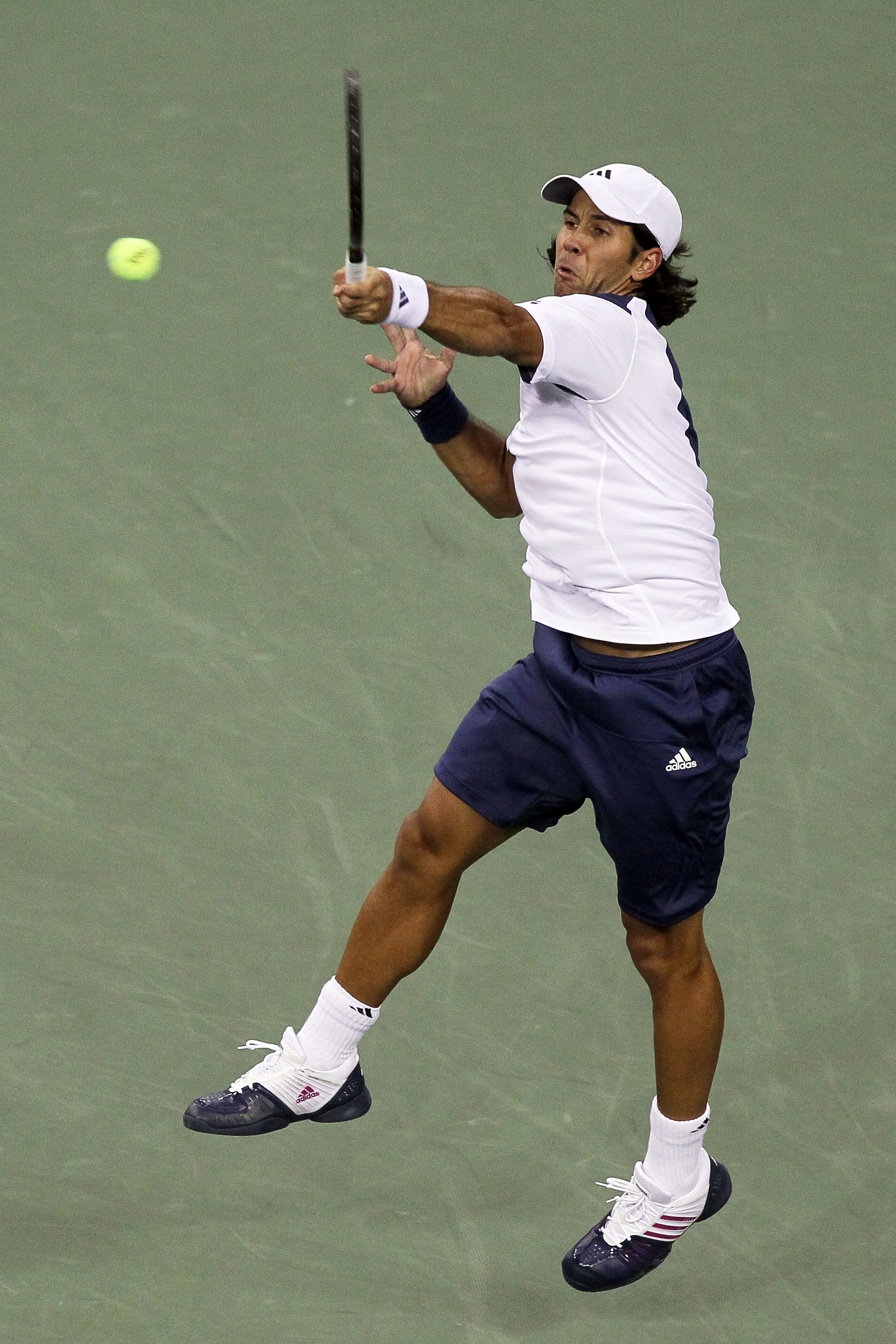NEW YORK - SEPTEMBER 09:  Fernando Verdasco of Spain returns a shot against Rafael Nadal of Spain during his men's single quarterfinal match on day eleven of the 2010 U.S. Open at the USTA Billie Jean King National Tennis Center on September 9, 2010 in th