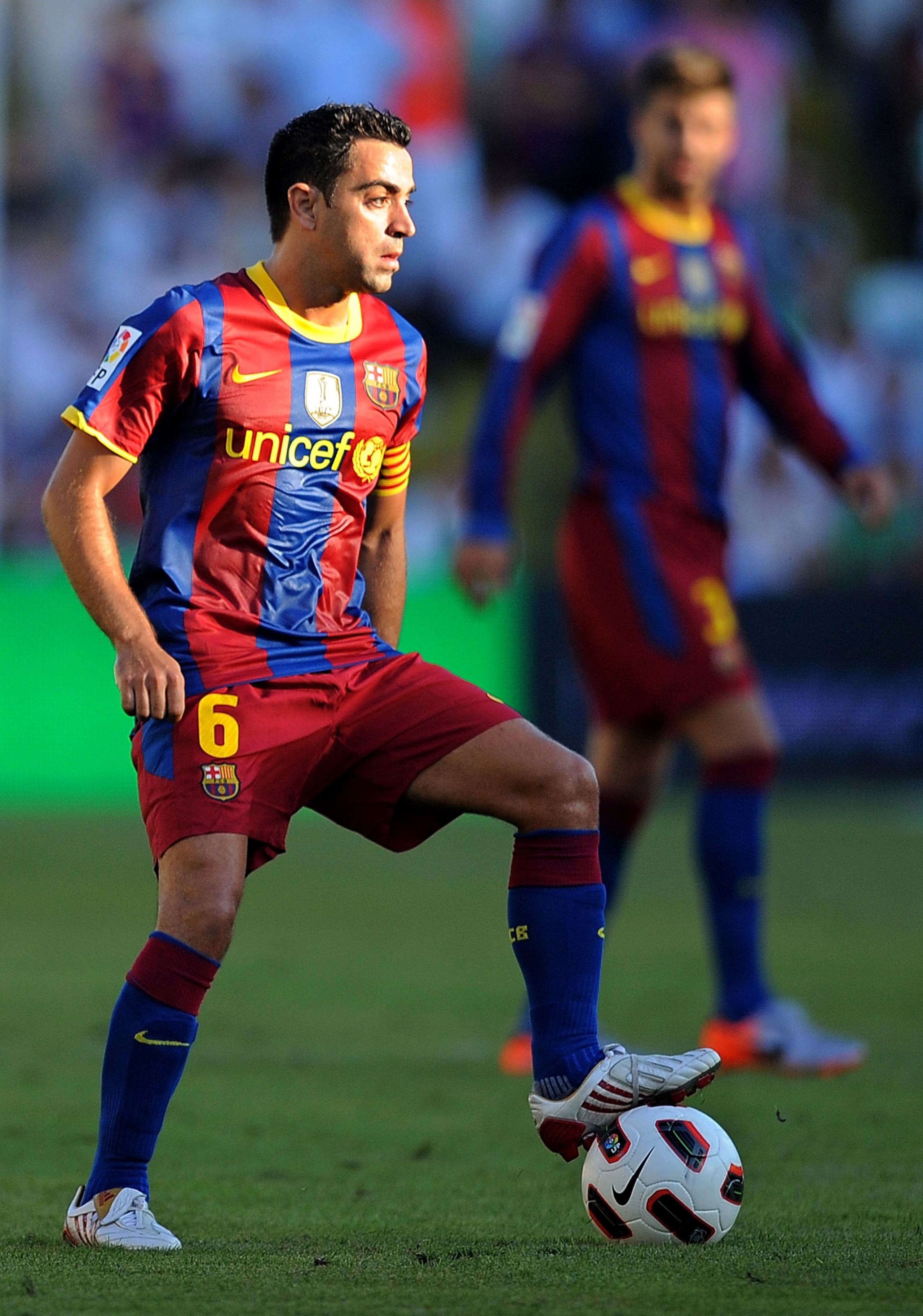 SANTANDER, SPAIN - AUGUST 29:  Xavi Hernandez of Barcelona controls the ball during the La Liga match between Racing Santander and Barcelona at El Sardinero stadium on August 29, 2010 in Santander, Spain.  (Photo by Denis Doyle/Getty Images)