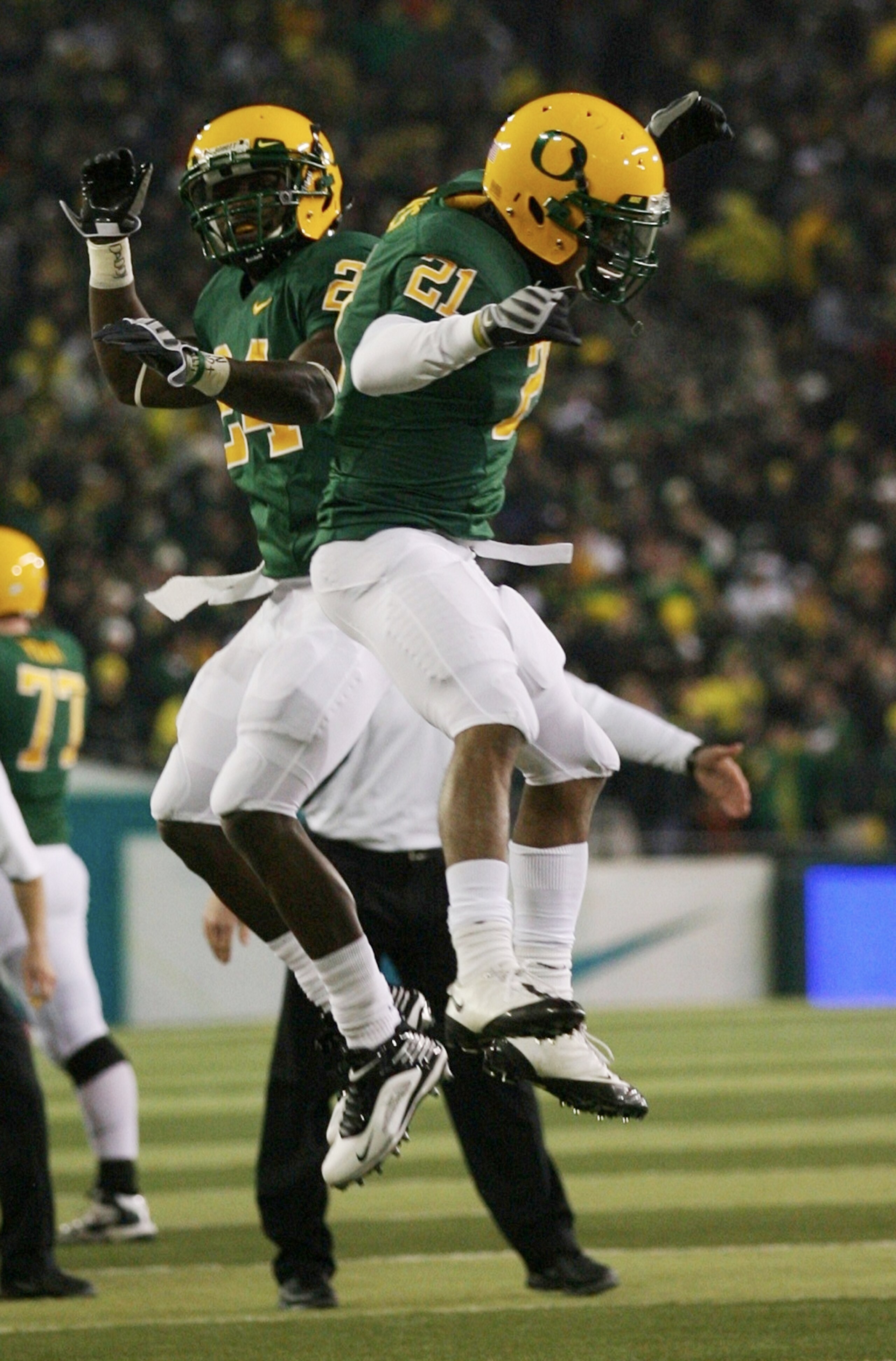 EUGENE,OR - DECEMBER 03: Running back LaMichael James #21 of the Oregon Ducks celebrates with teammate Ryan McCants #24 after scoring a touchdown against the Oregon State Beavers at Autzen Stadium on December 3, 2009 in Eugene, Oregon. (Photo by Tom Hauc EUGENE,OR - DECEMBER 03: Running back LaMichael James #21 of the Oregon Ducks celebrates with teammate Ryan McCants #24 after scoring a touchdown against the Oregon State Beavers at Autzen Stadium on December 3, 2009 in Eugene, Oregon. (Photo by Tom Hauc