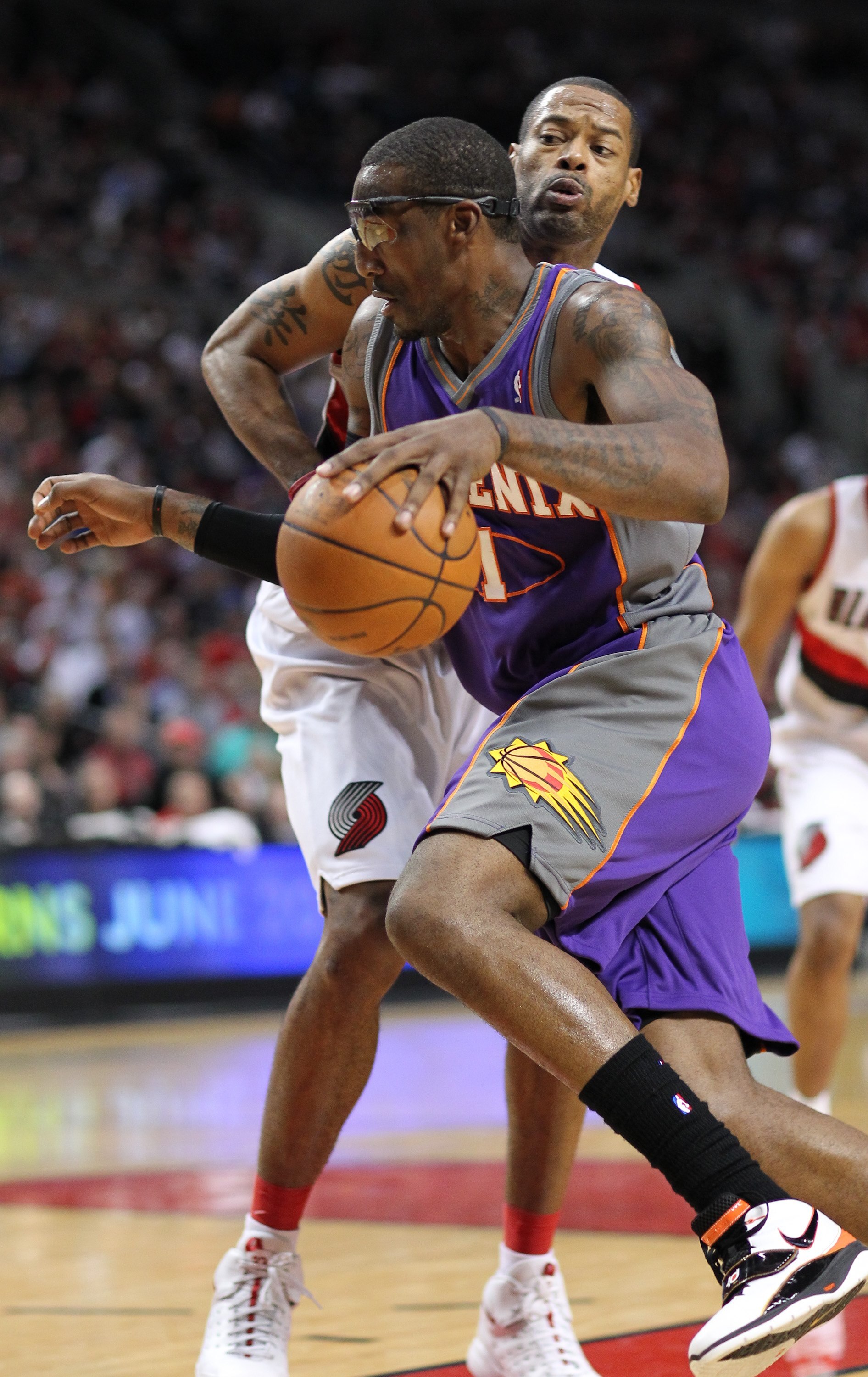 PORTLAND, OR - APRIL 29:  Amare Stoudemire #1 of the Phoenix Suns in action against Marcus Camby #21 of the Portland Trail Blazers during Game Six of the Western Conference Quarterfinals of the NBA Playoffs on April 29, 2010 at the Rose Garden in Portland