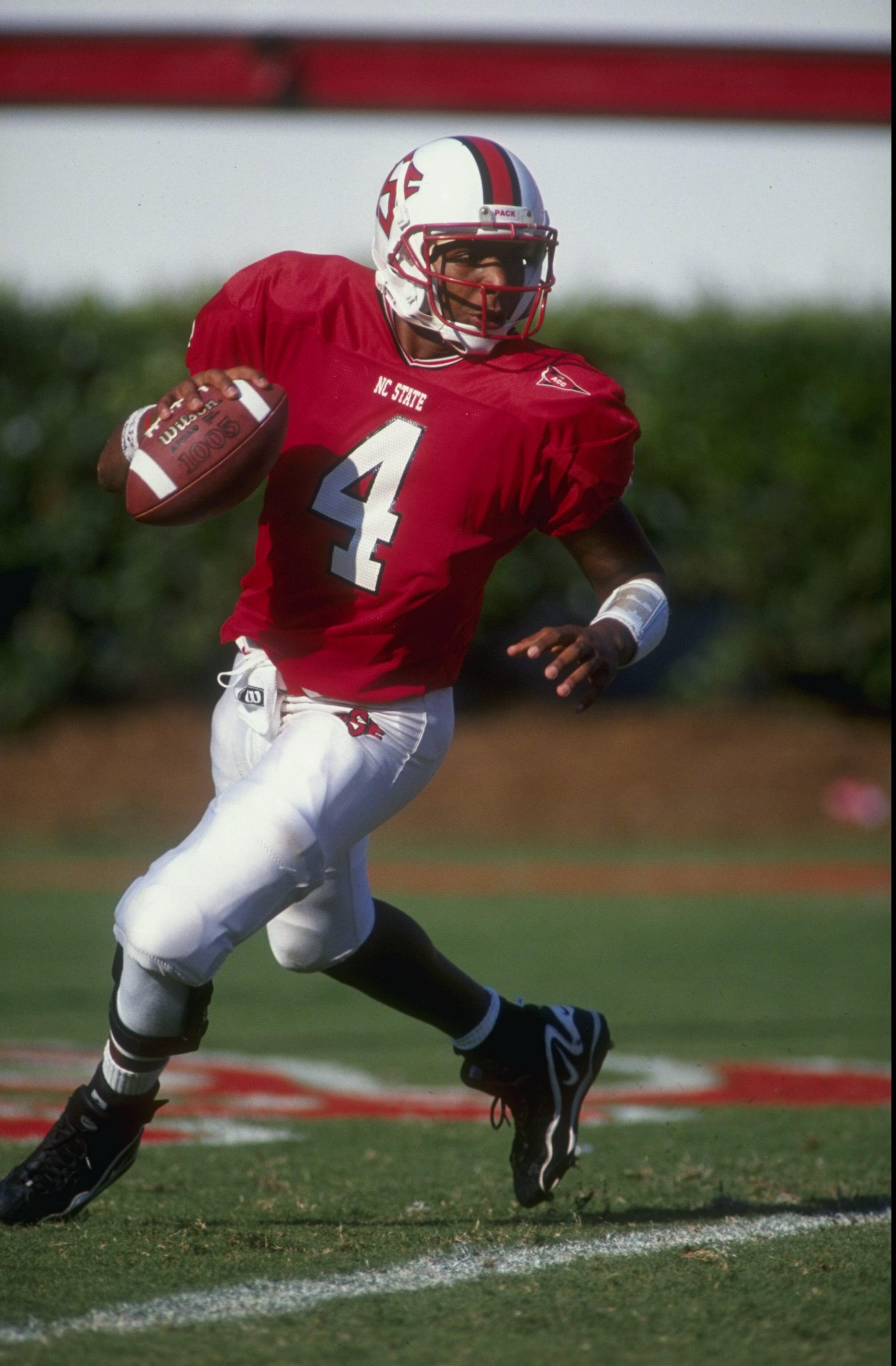 12 Sep 1998:  Quarterback Jamie Barnette #4 of the North Carolina State Wolfpack runs back and looks to throw during the game against the  Florida State University Seminals at Carter Finley Stadium in Raleigh, North Carolina. North Carolina State defeated