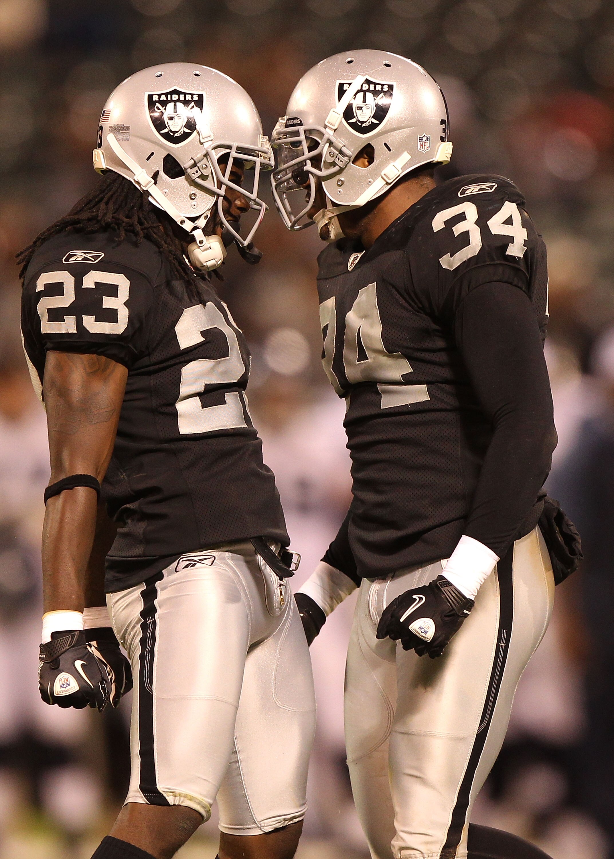 OAKLAND, CA - SEPTEMBER 2: Jeremy Ware #23 and Mike Mitchell #34 of the Oakland Raiders celebrate against the Seattle Seahawks during an NFL preseason game at Oakland-Alameda County Coliseum on September 2, 2010 in Oakland, California. (Photo by Jed Jac OAKLAND, CA - SEPTEMBER 2: Jeremy Ware #23 and Mike Mitchell #34 of the Oakland Raiders celebrate against the Seattle Seahawks during an NFL preseason game at Oakland-Alameda County Coliseum on September 2, 2010 in Oakland, California. (Photo by Jed Jac