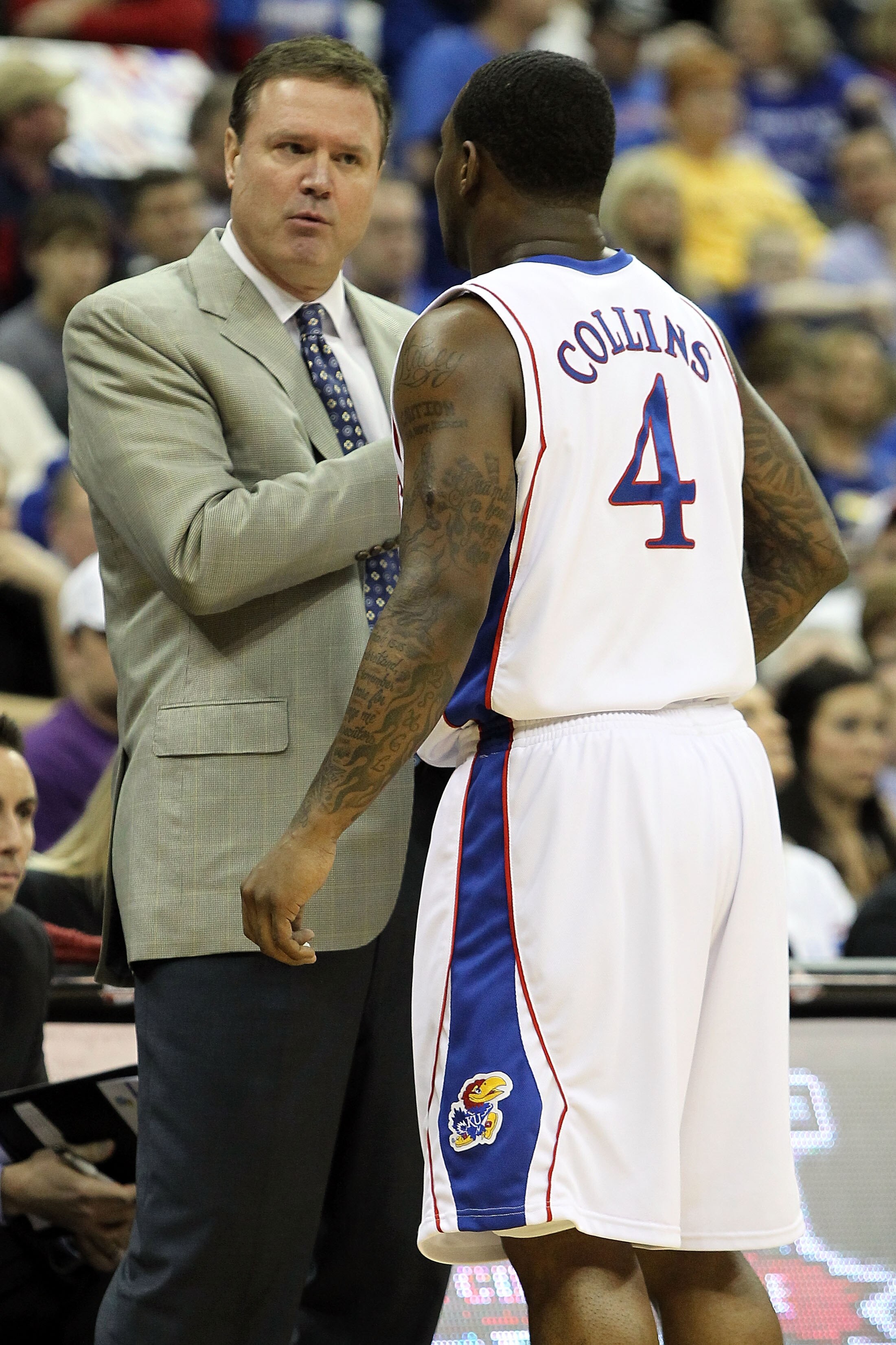 KANSAS CITY, MO - MARCH 11:  Head coach Bill Self of the Kansas Jayhawks talks with Sherron Collins #4 in the first half while taking on the Texas Tech Red Raiders during the quarterfinals of the 2010 Phillips 66 Big 12 Men's Basketball Tournament at the 