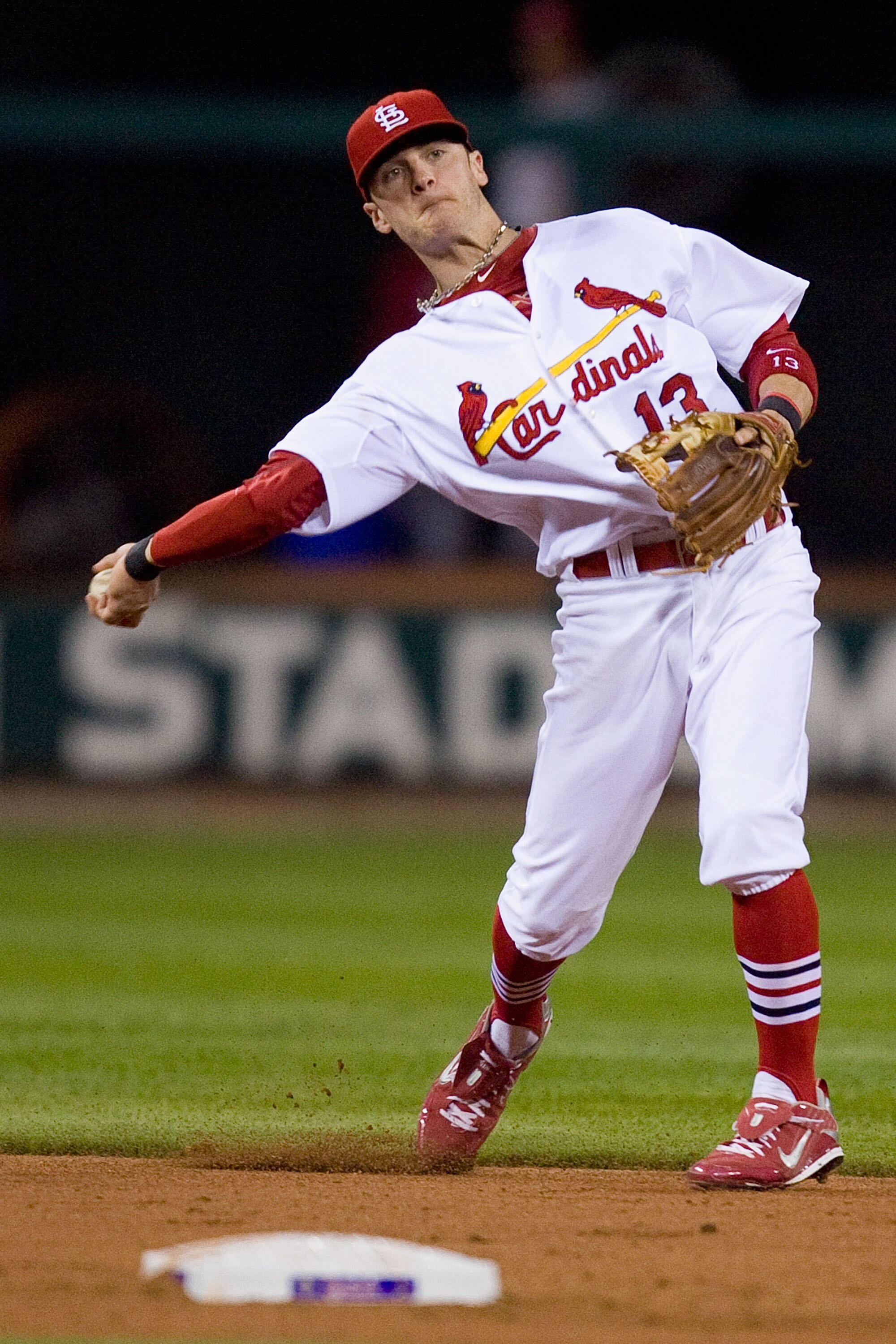 ST. LOUIS - SEPTEMBER 3: Brendan Ryan #13 of the St. Louis Cardinals throws to first base against the Cincinnati Reds at Busch Stadium on September 3, 2010 in St. Louis, Missouri.  The Cardinals beat the Reds 3-2.  (Photo by Dilip Vishwanat/Getty Images)