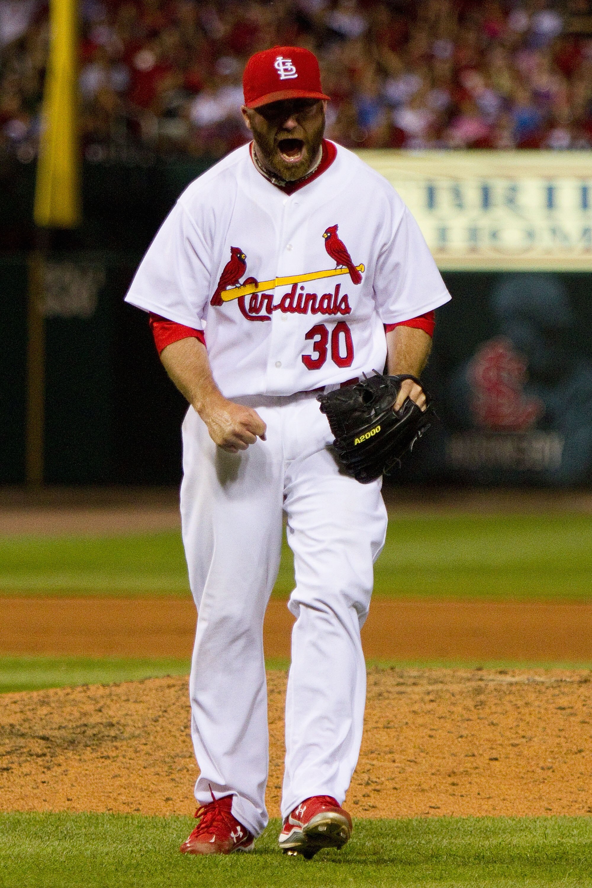 ST. LOUIS - JUNE 16: Relief pitcher Jason Motte #30 of the St. Louis Cardinals reacts to getting his third out against the Seattle Mariners at Busch Stadium on June 16, 2010 in St. Louis, Missouri.  (Photo by Dilip Vishwanat/Getty Images)