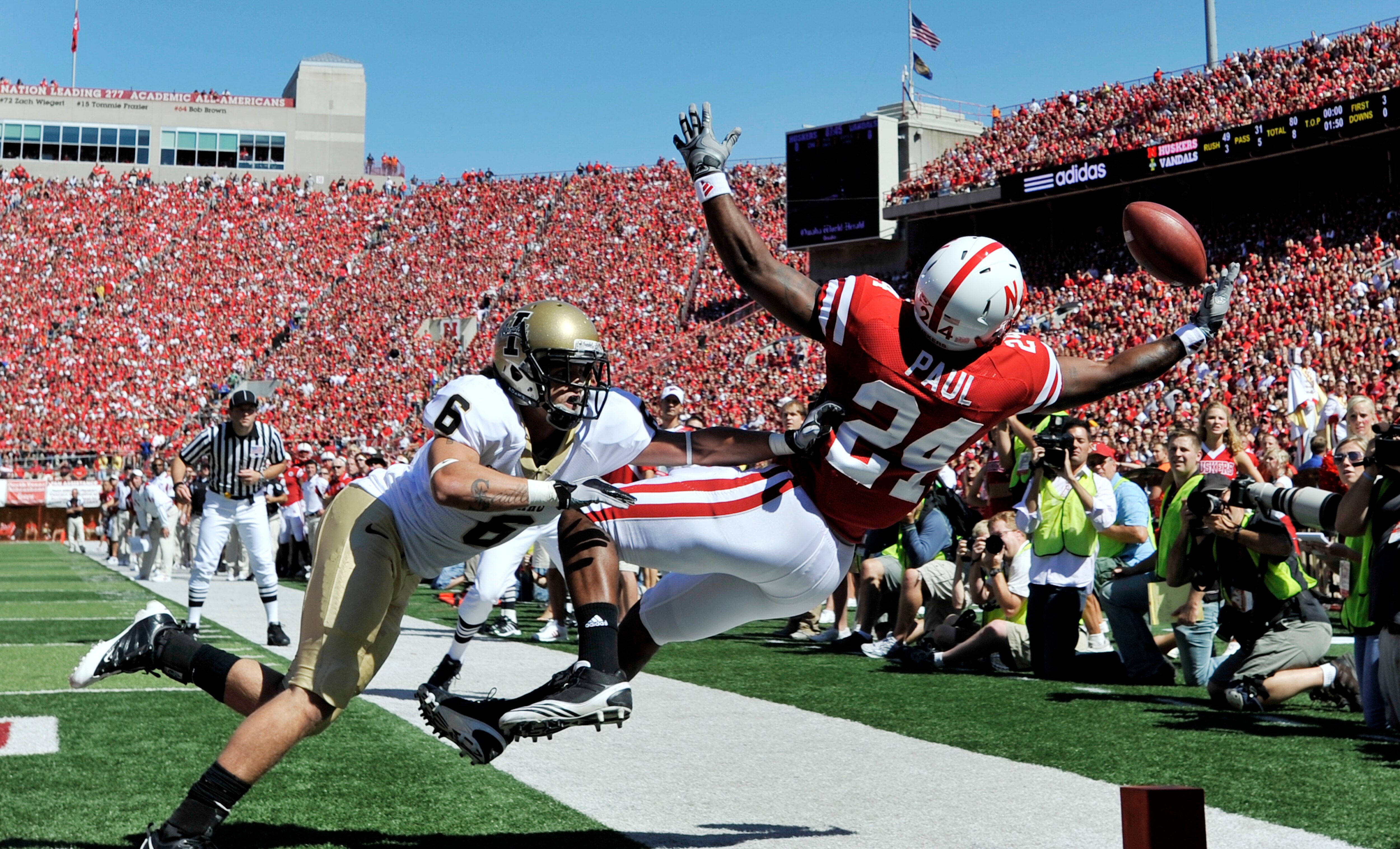 LINCOLN, NE - SEPTEMBER 11: Nebraska Cornhuskers wide receiver Niles Paul #24 leaps for an incomplete pass over Idaho Vandals cornerback Aaron Grymes #6 during first half action of their game at Memorial Stadium on September 4, 2010 in Lincoln, Nebraska.