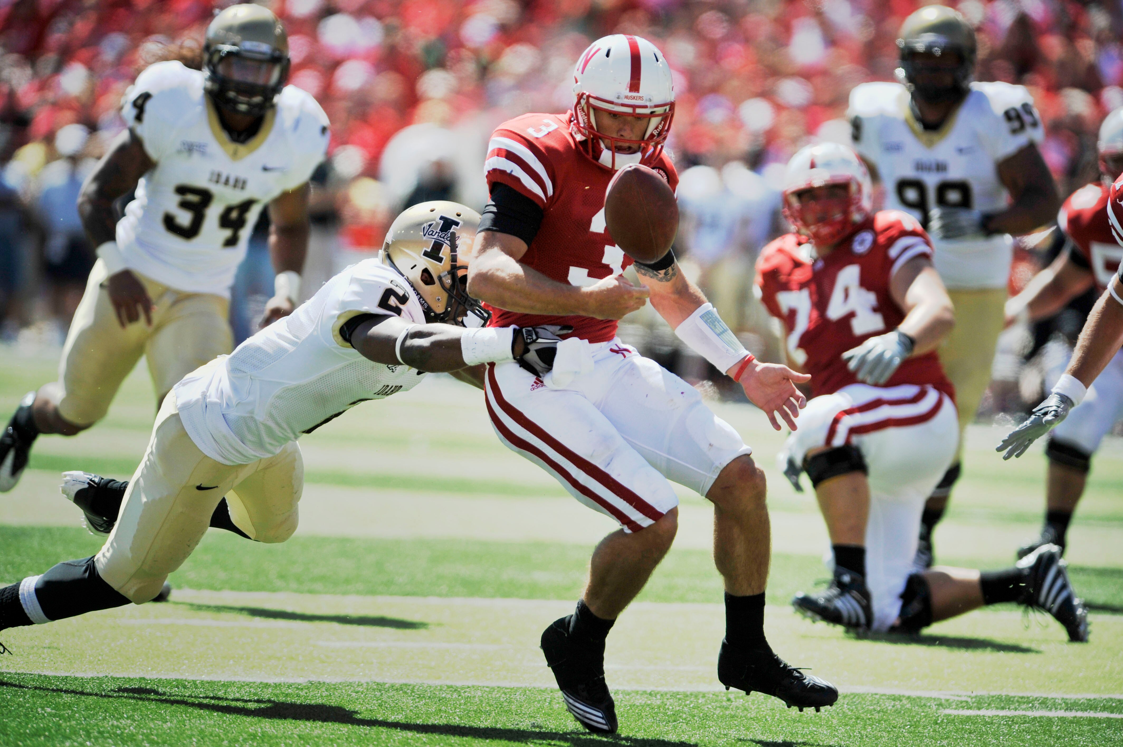 LINCOLN, NE - SEPTEMBER 11: Nebraska Cornhuskers quarterback Taylor Martinez #3 has the ball stripped away during second half action of their game at Memorial Stadium on September 4, 2010 in Lincoln, Nebraska. Martinez covered the ball in the end zone for