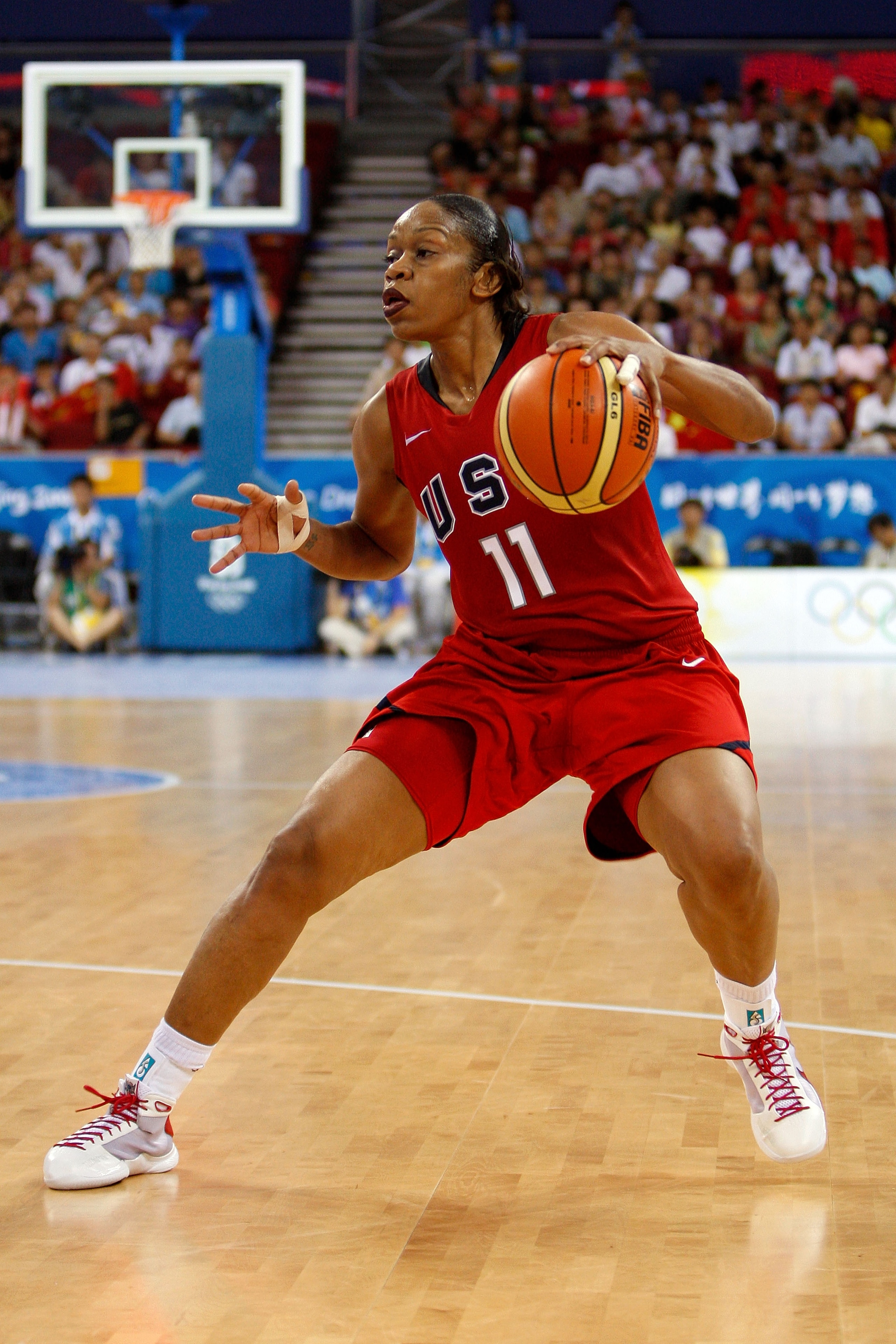 BEIJING - AUGUST 11:  Tina Thompson #11 of the United States drives against China during their women's basketball game on Day 3 of the Beijing 2008 Olympic Games at the Wukesong Indoor Stadium on August 11, 2008 in Beijing, China.  (Photo by Streeter Leck
