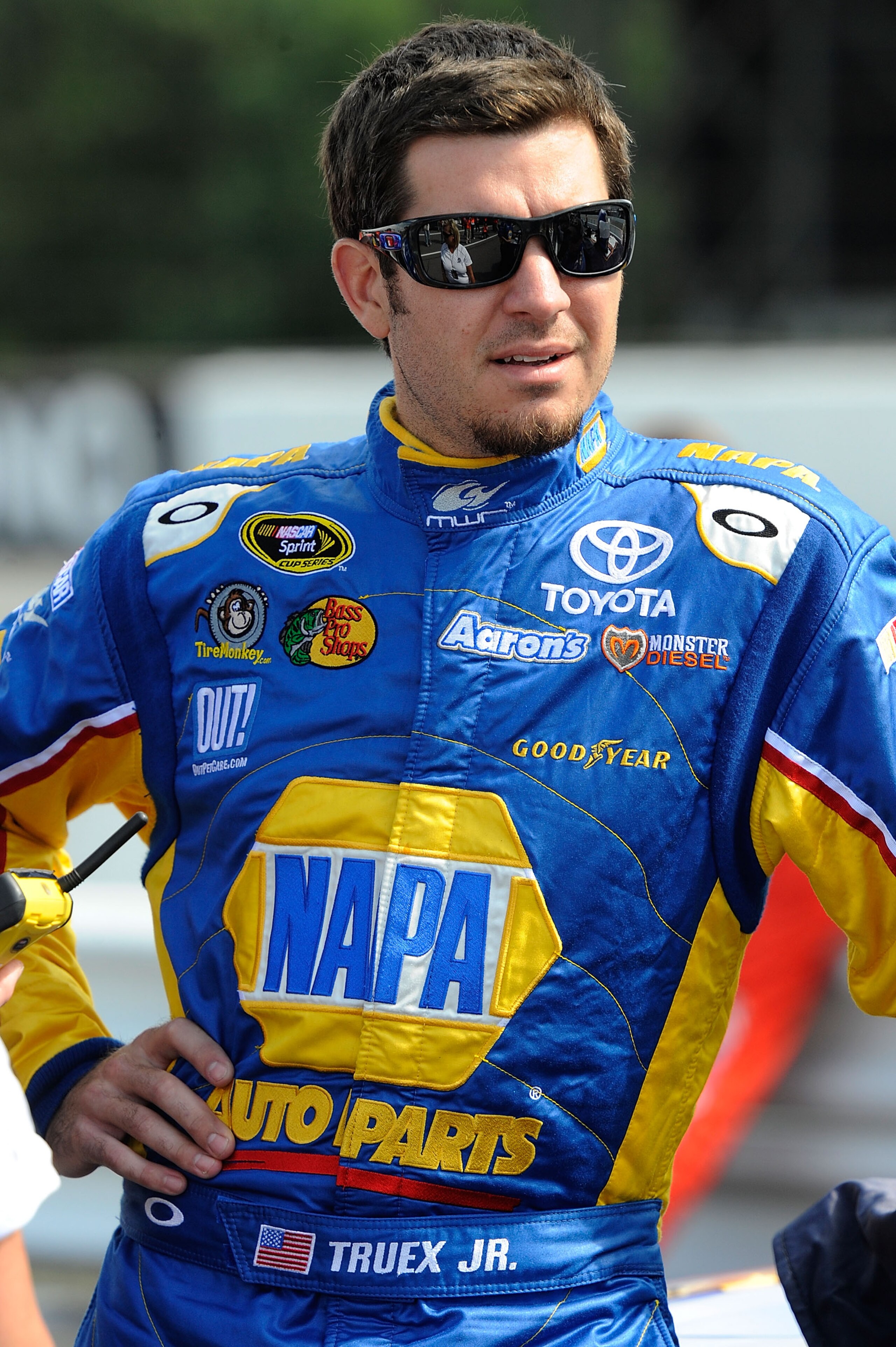 LONG POND, PA - JULY 30:  Martin Truex Jr., driver of the #56 NAPA Auto Parts Toyota, stands on the grid during qualifying for the NASCAR Sprint Cup Series Sunoco Red Cross Pennsylvania 500 at Pocono Raceway on July 30, 2010 in Long Pond, Pennsylvania.  (