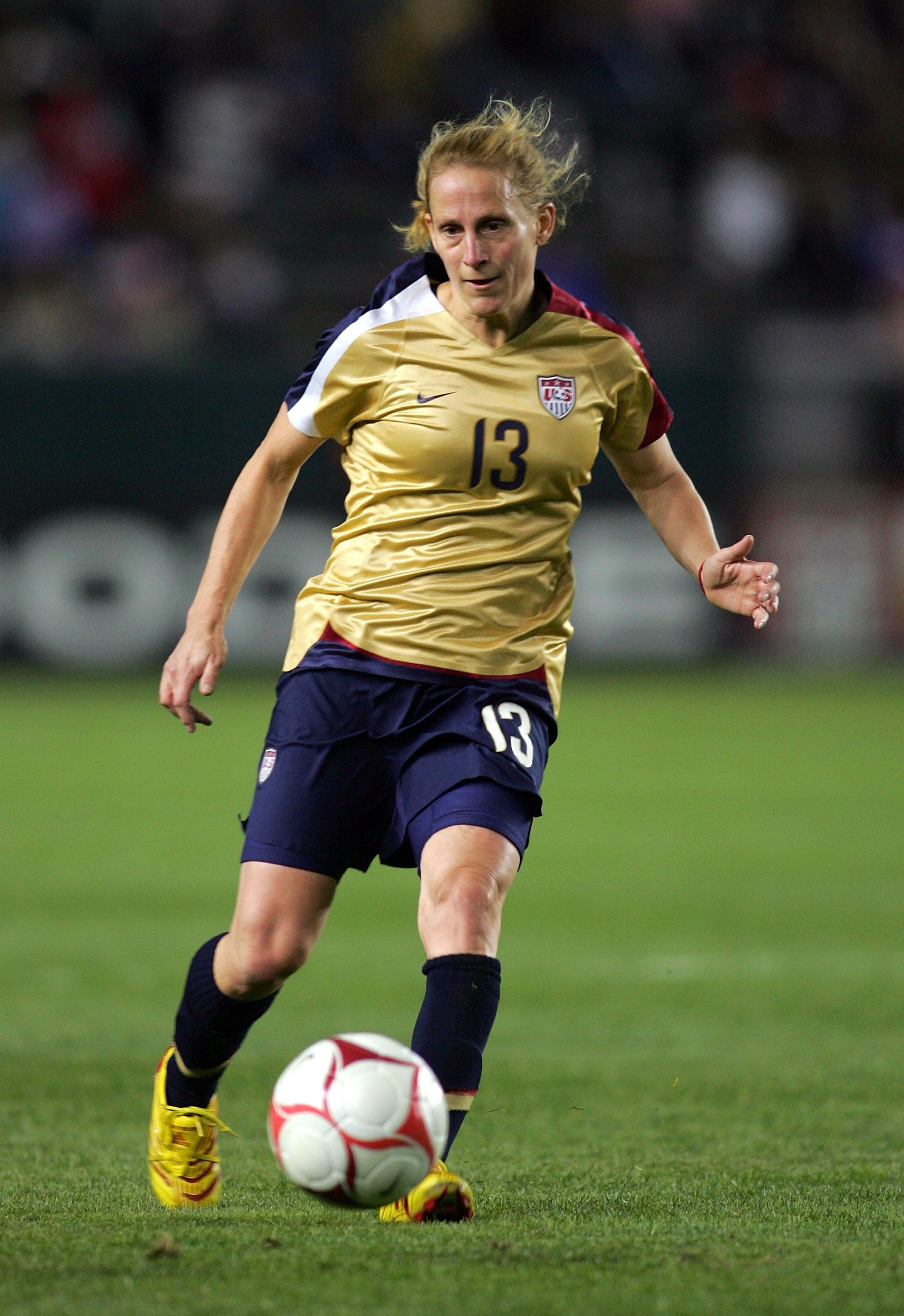 CARSON, CA - DECEMBER 13:  Kristine Lilly #13 of the USA passes the ball during their international friendly match against China at The Home Depot Center on December 13, 2008 in Carson, California. The USA defeated China 1-0.  (Photo by Victor Decolongon/