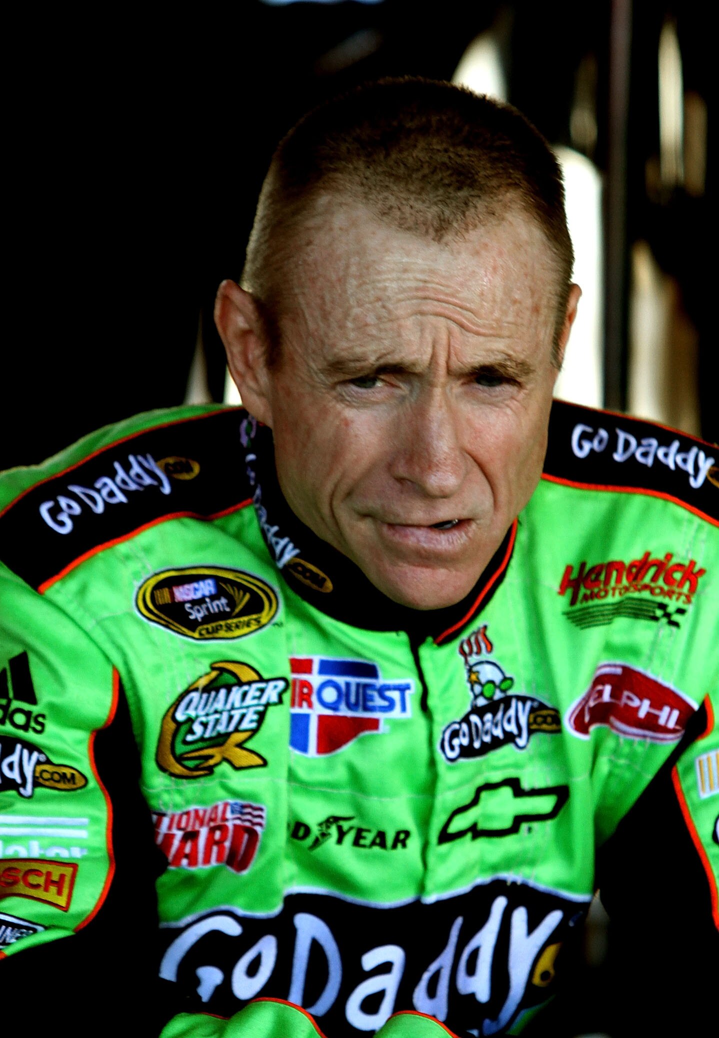 RICHMOND, VA - SEPTEMBER 10:  Mark Martin, driver of the #5 GoDaddy.com Chevrolet, waits in the garage during practice for the NASCAR Sprint Cup Series Air Guard 400 at Richmond International Raceway on September 10, 2010 in Richmond, Virginia.  (Photo by