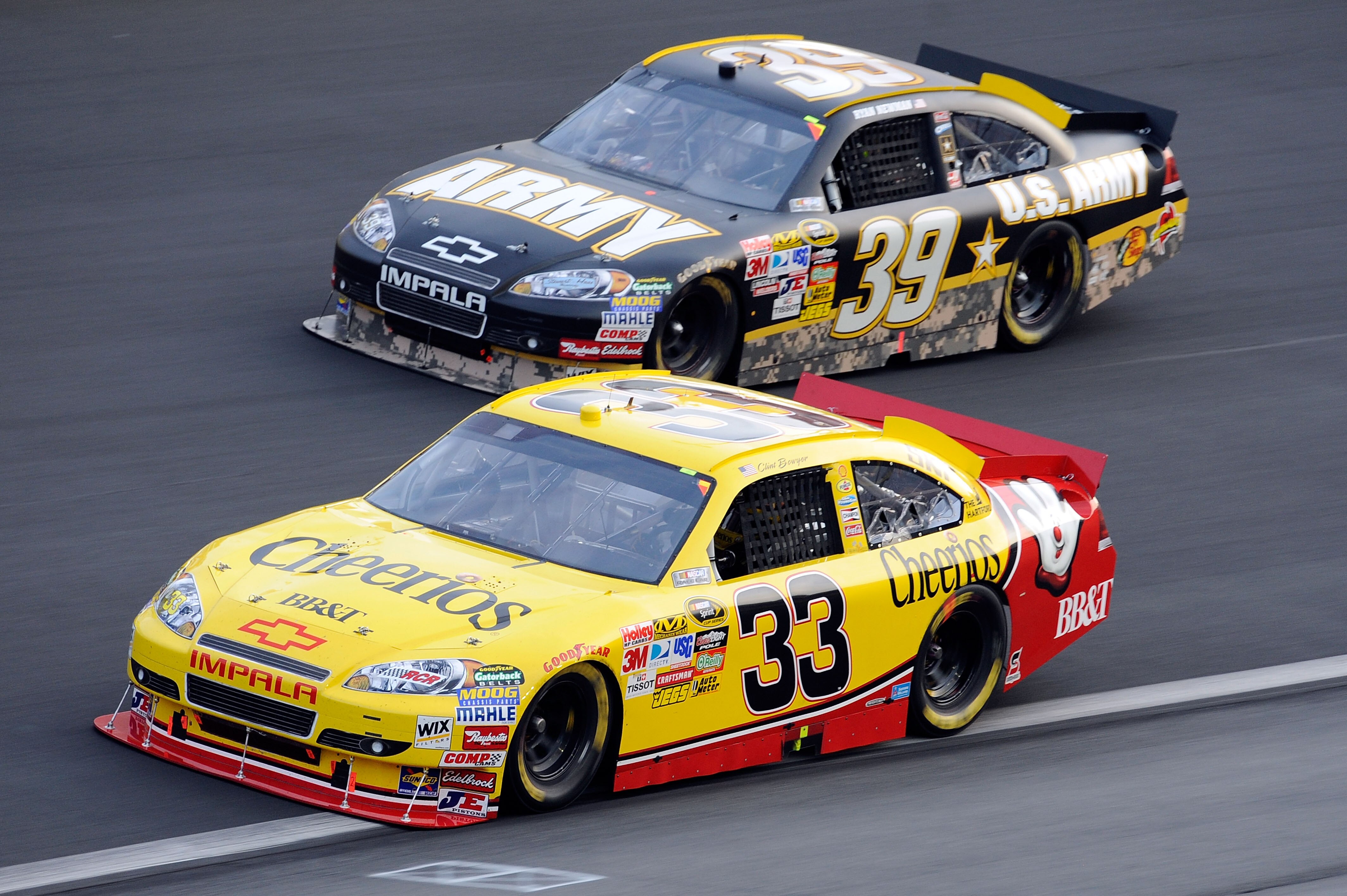CONCORD, NC - MAY 30:  Clint Bowyer, driver of the #33 Cheerios/Hamburger Helper Chevrolet, and Ryan Newman, driver of the #39 U.S. Army Chevrolet, race side by side during the NASCAR Sprint Cup Series Coca-Cola 600 at Charlotte Motor Speedway on May 30,